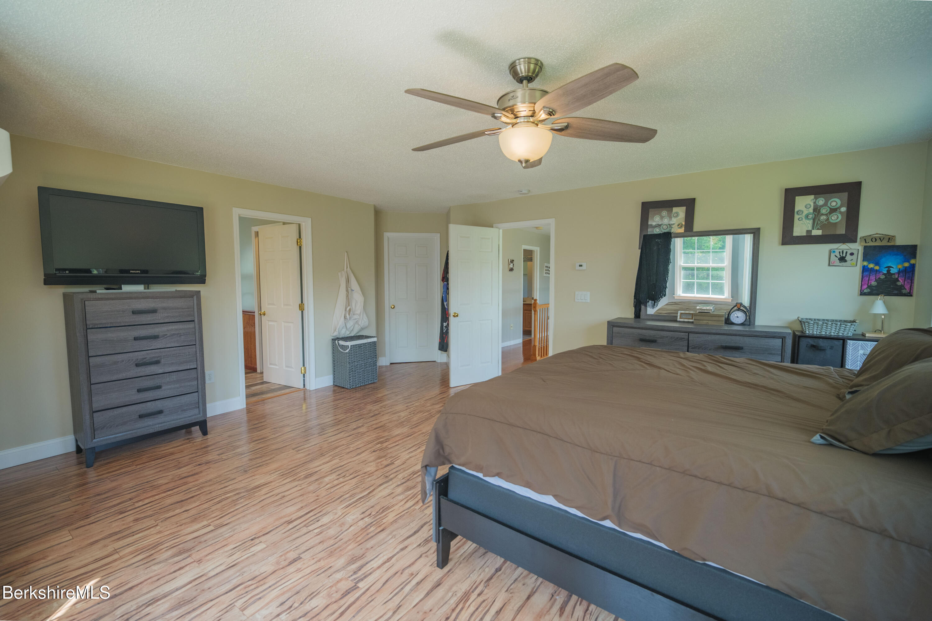 155 High St Hill Road Windsor, MA 01270 - Photo 14 of 26 a bedroom with a bed and wooden floor