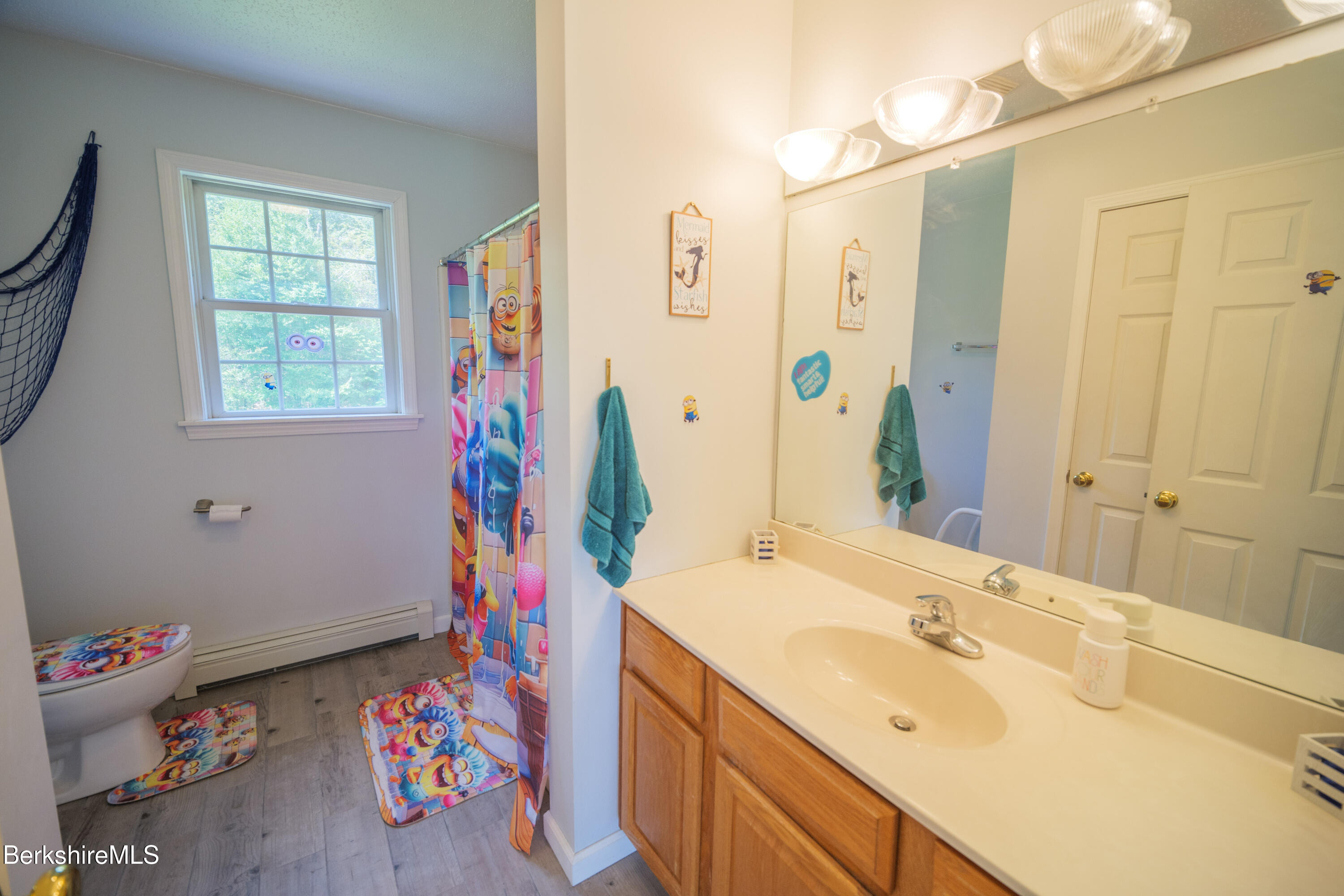 155 High St Hill Road Windsor, MA 01270 - Photo 18 of 26 a bathroom with a sink mirror and vanity