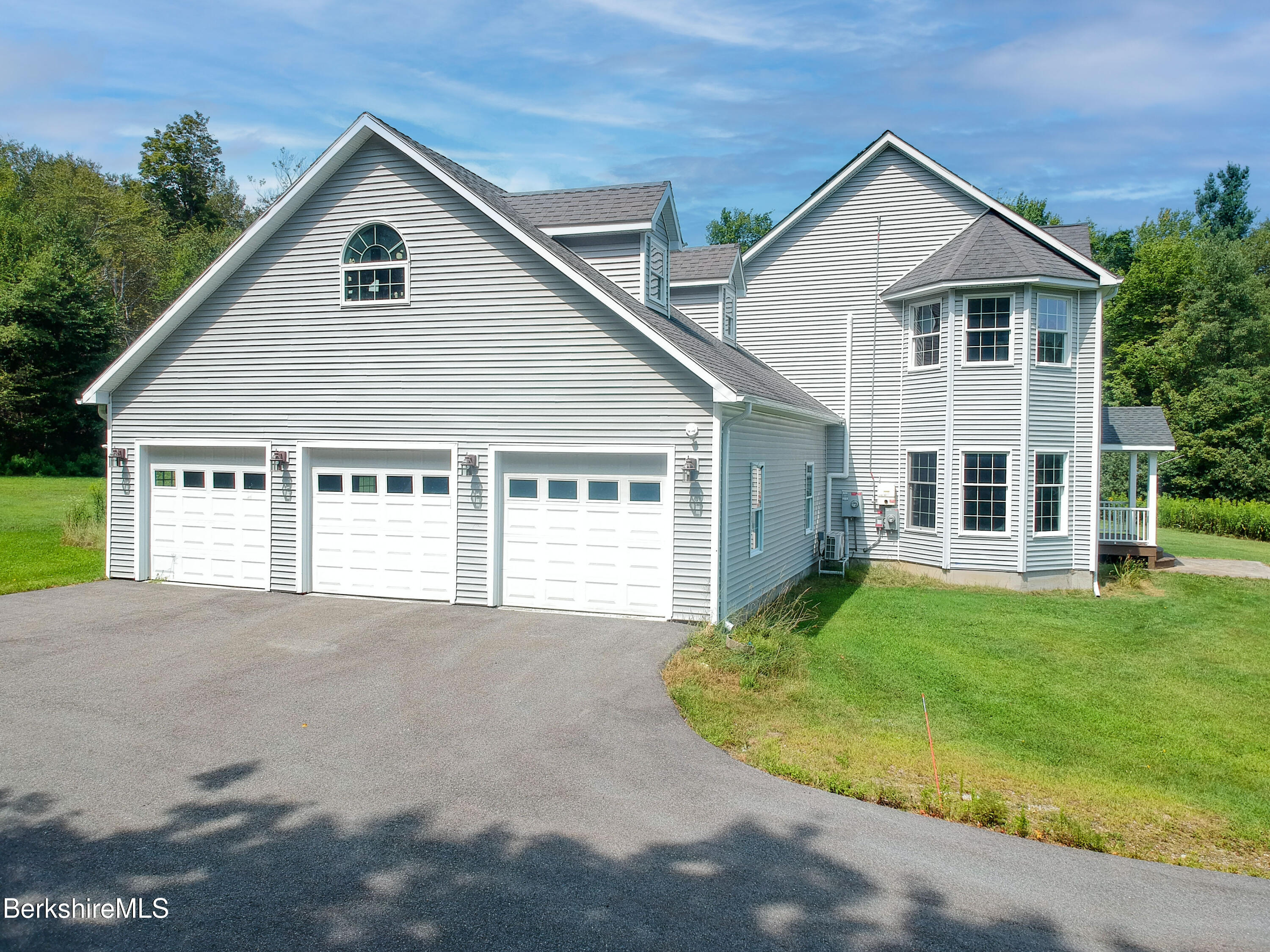 155 High St Hill Road Windsor, MA 01270 - Photo 24 of 26 a view of a house with a yard and garage