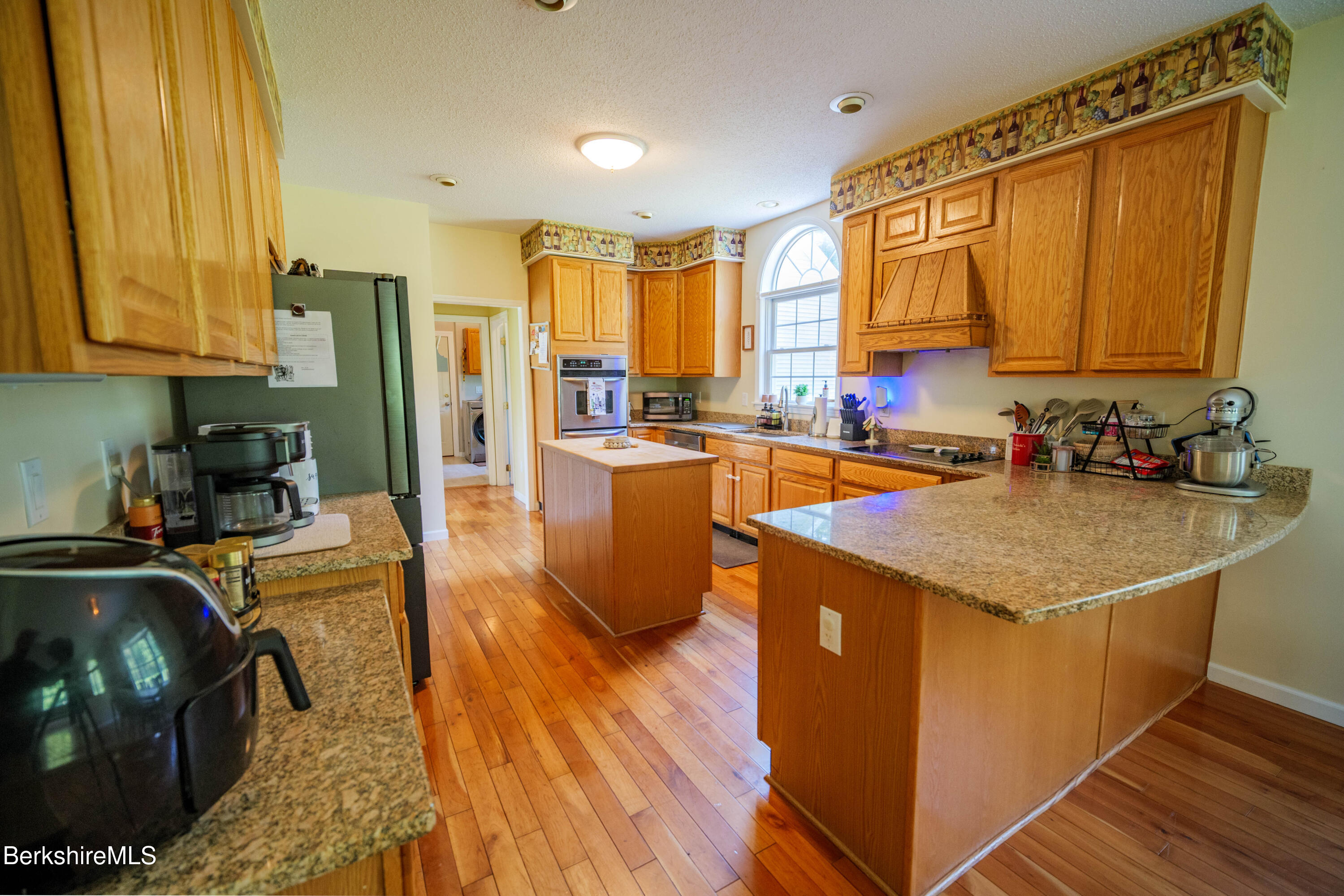 155 High St Hill Road Windsor, MA 01270 - Photo 4 of 26 a kitchen with stainless steel appliances granite countertop a sink a stove and a wooden floors