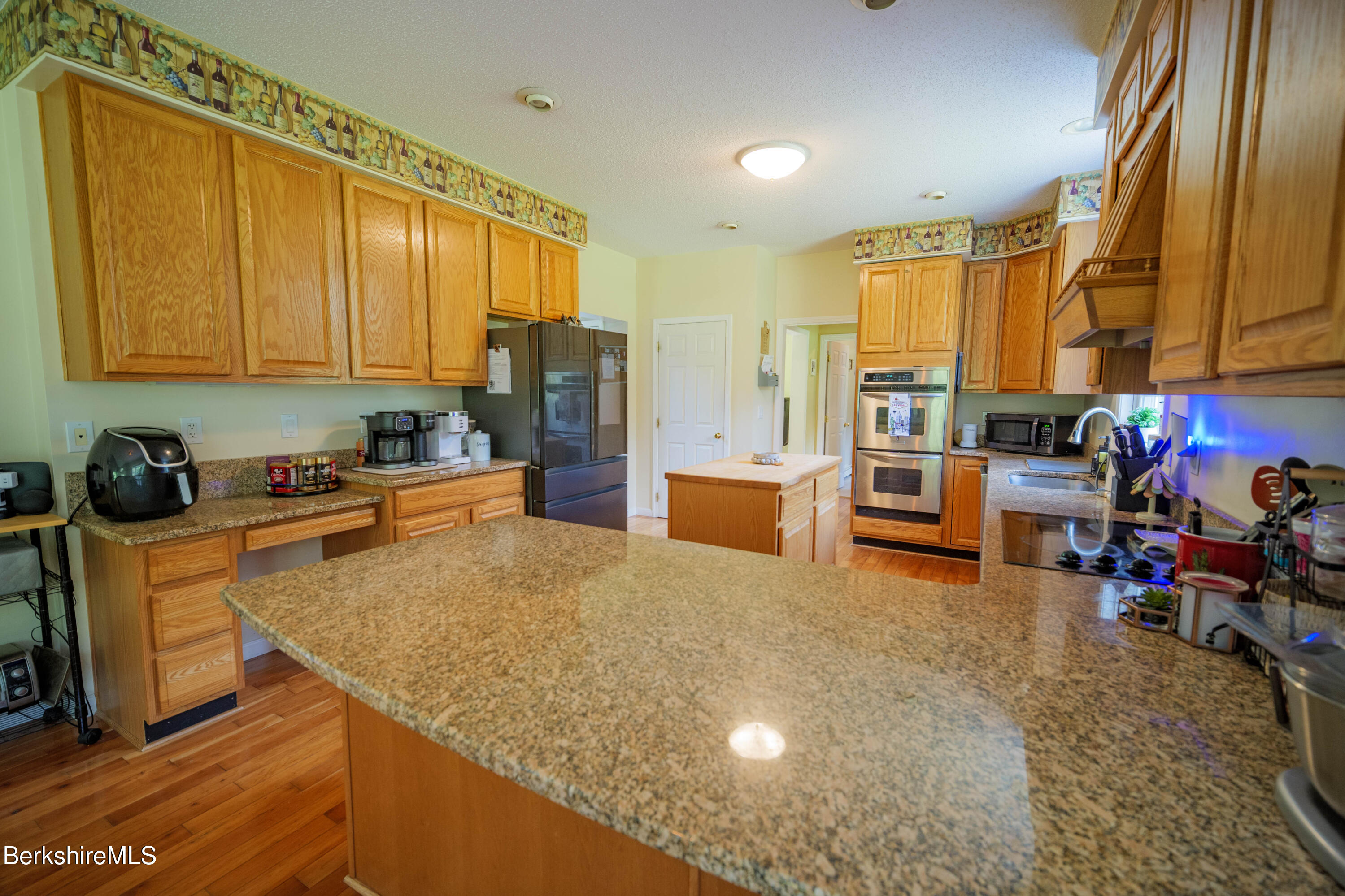 155 High St Hill Road Windsor, MA 01270 - Photo 5 of 26 a kitchen with stainless steel appliances granite countertop a sink refrigerator and cabinets