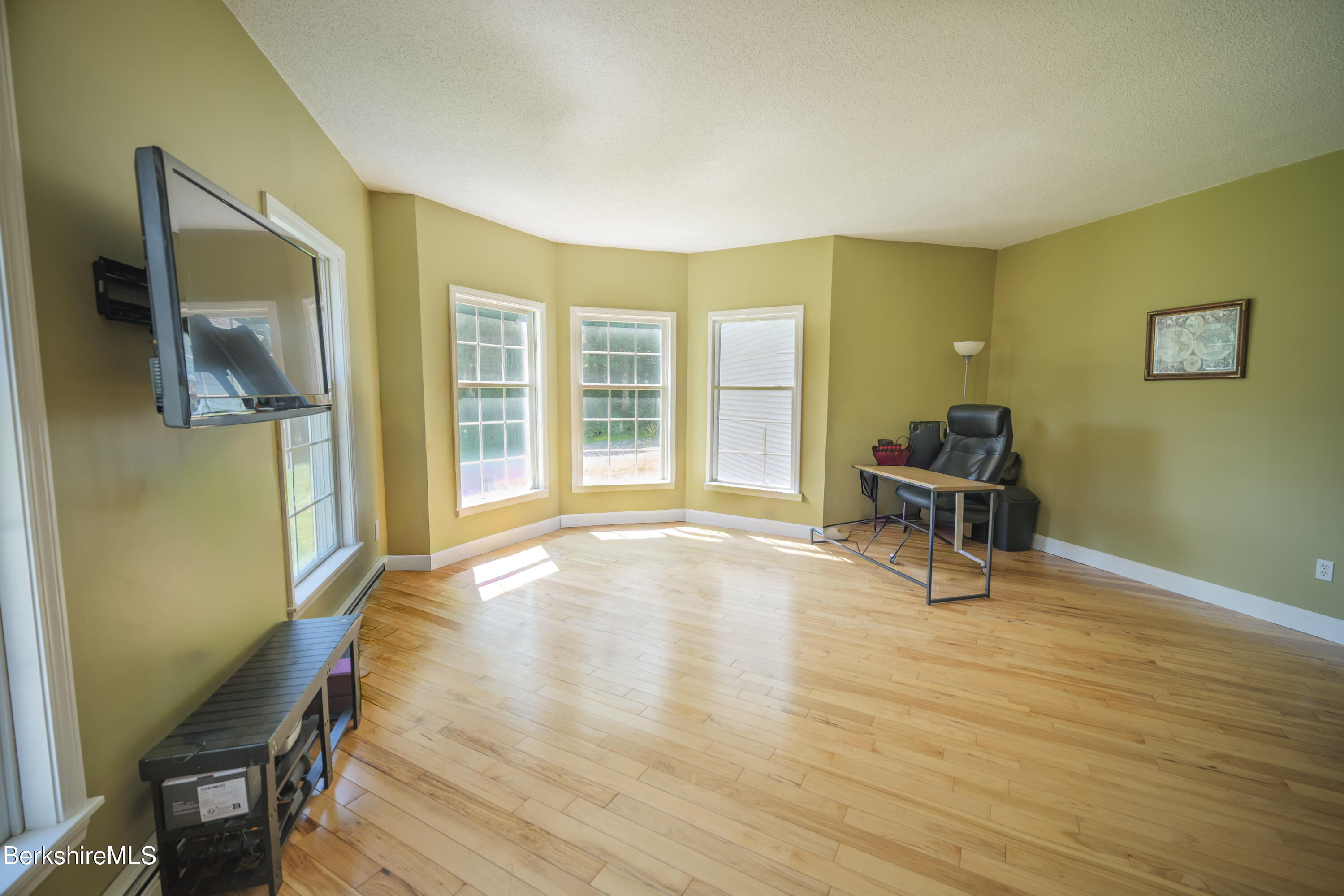 155 High St Hill Road Windsor, MA 01270 - Photo 6 of 26 a view of an empty room with wooden floor and a window