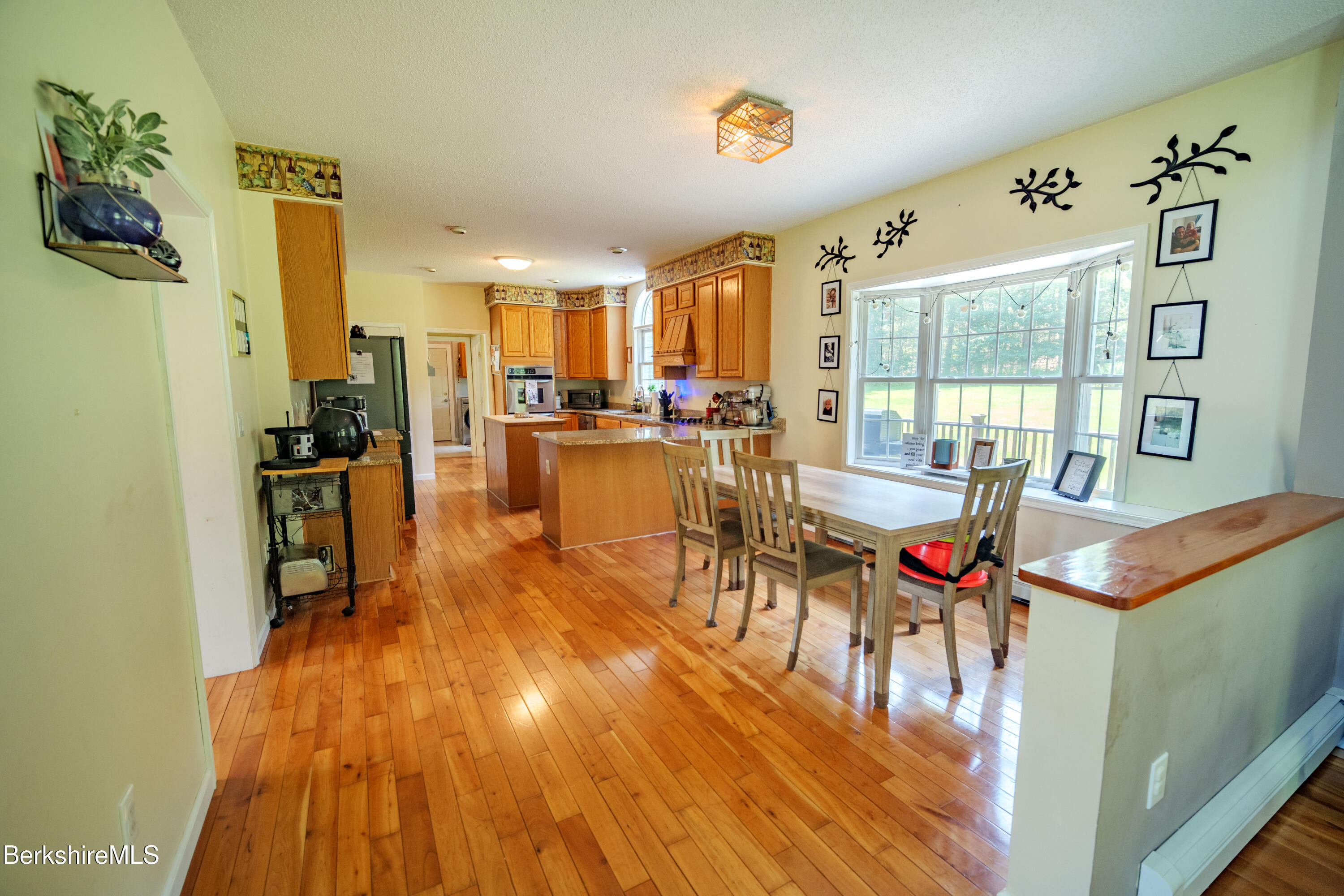 155 High St Hill Road Windsor, MA 01270 - Photo 8 of 26 a living room with furniture and a wooden floor