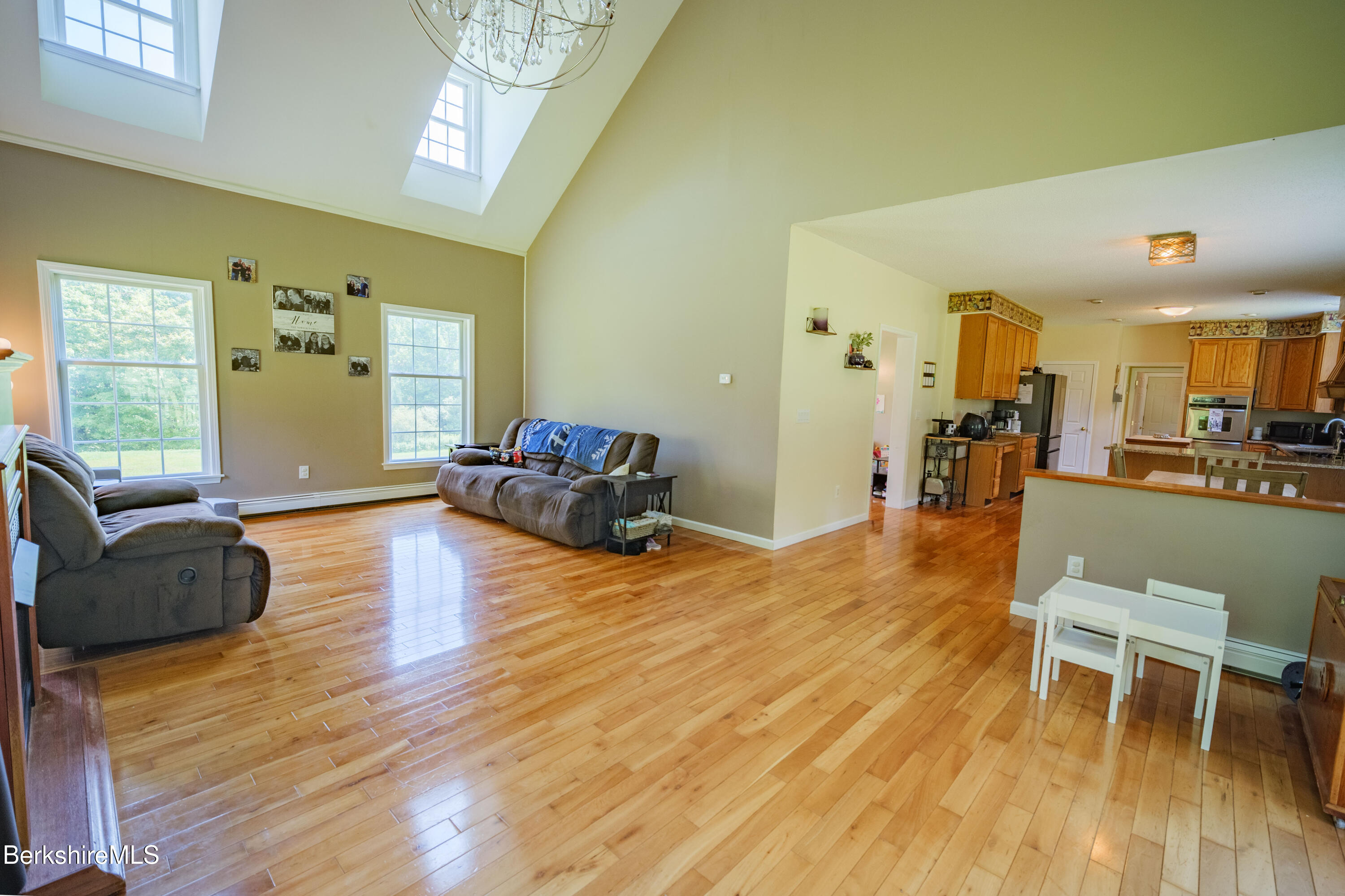 155 High St Hill Road Windsor, MA 01270 - Photo 9 of 26 a living room with furniture and a wooden floor