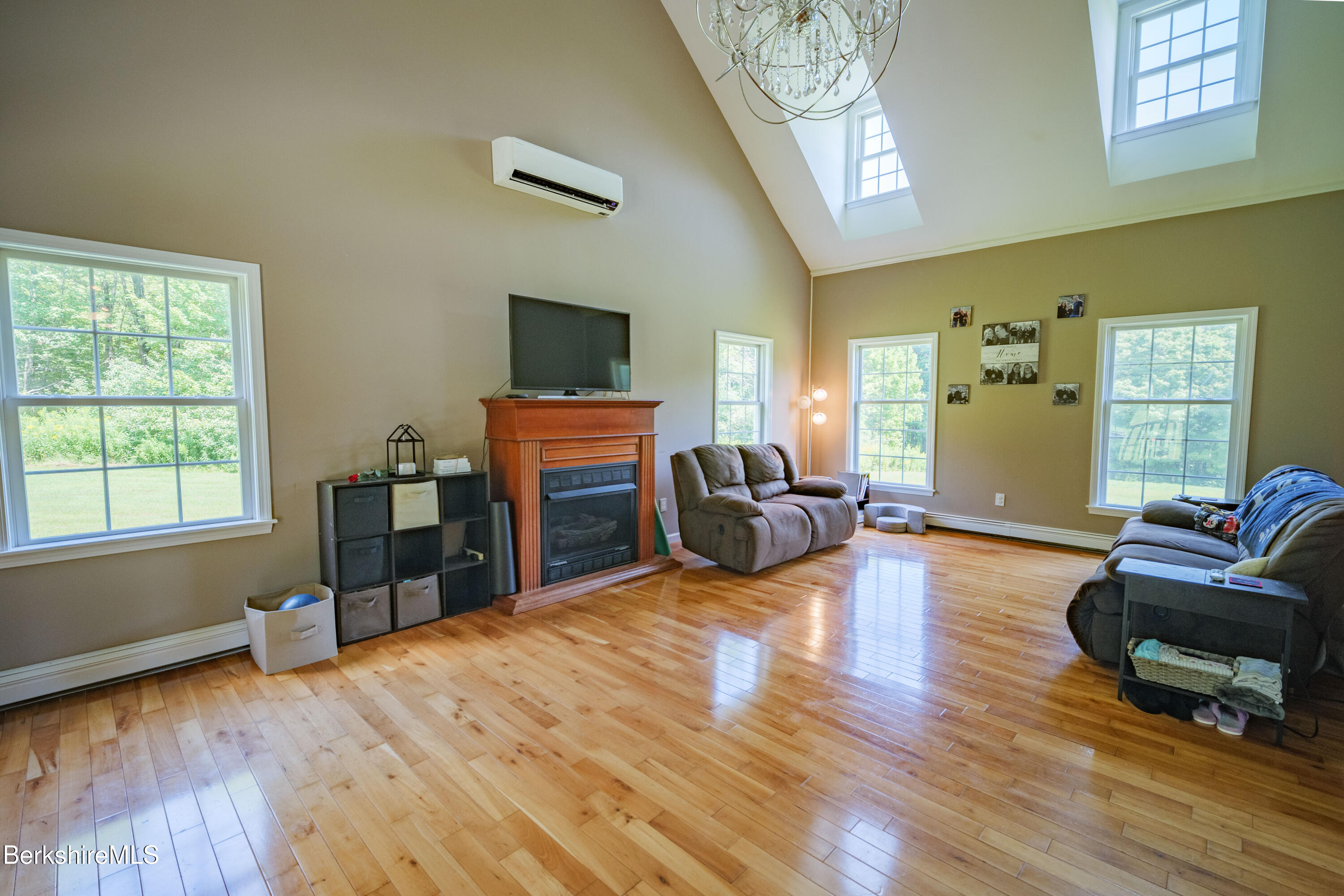 155 High St Hill Road Windsor, MA 01270 - Photo 10 of 26 a living room with furniture and a flat screen tv