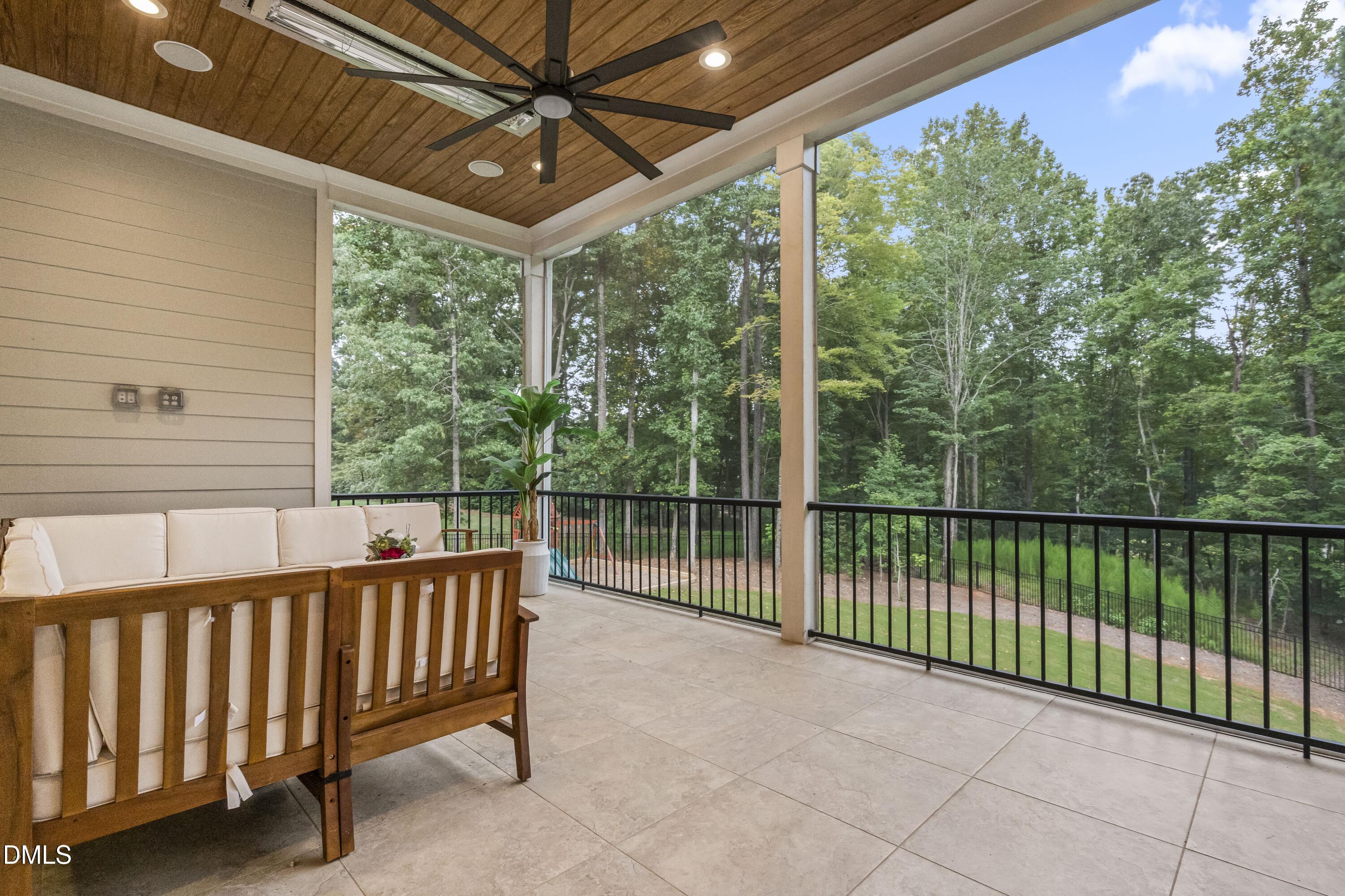 2205 Duskywing Drive Raleigh, NC 27613 - Photo 15 of 38 a balcony with trees in front of it