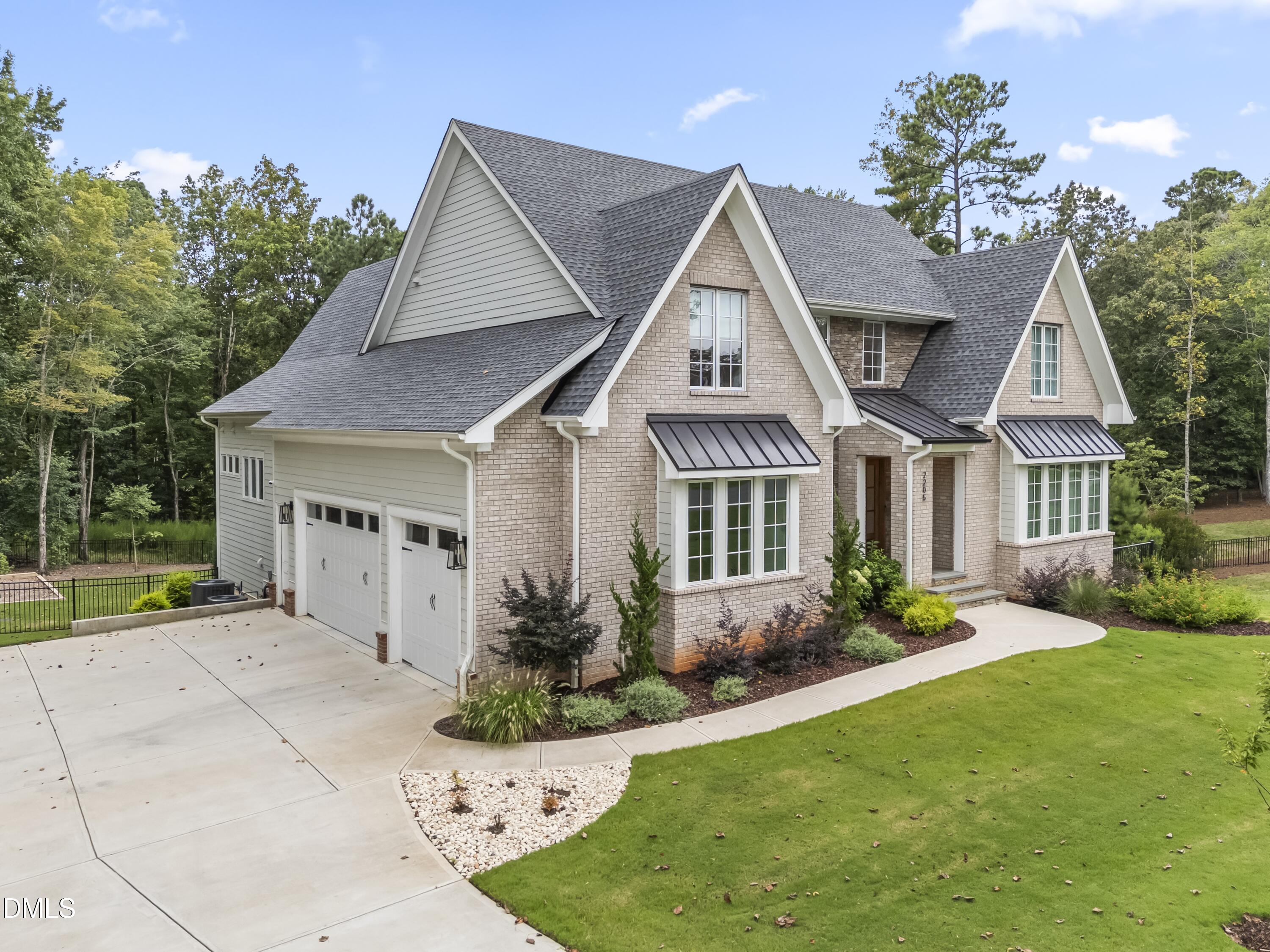 2205 Duskywing Drive Raleigh, NC 27613 - Photo 2 of 38 a front view of a house with garden
