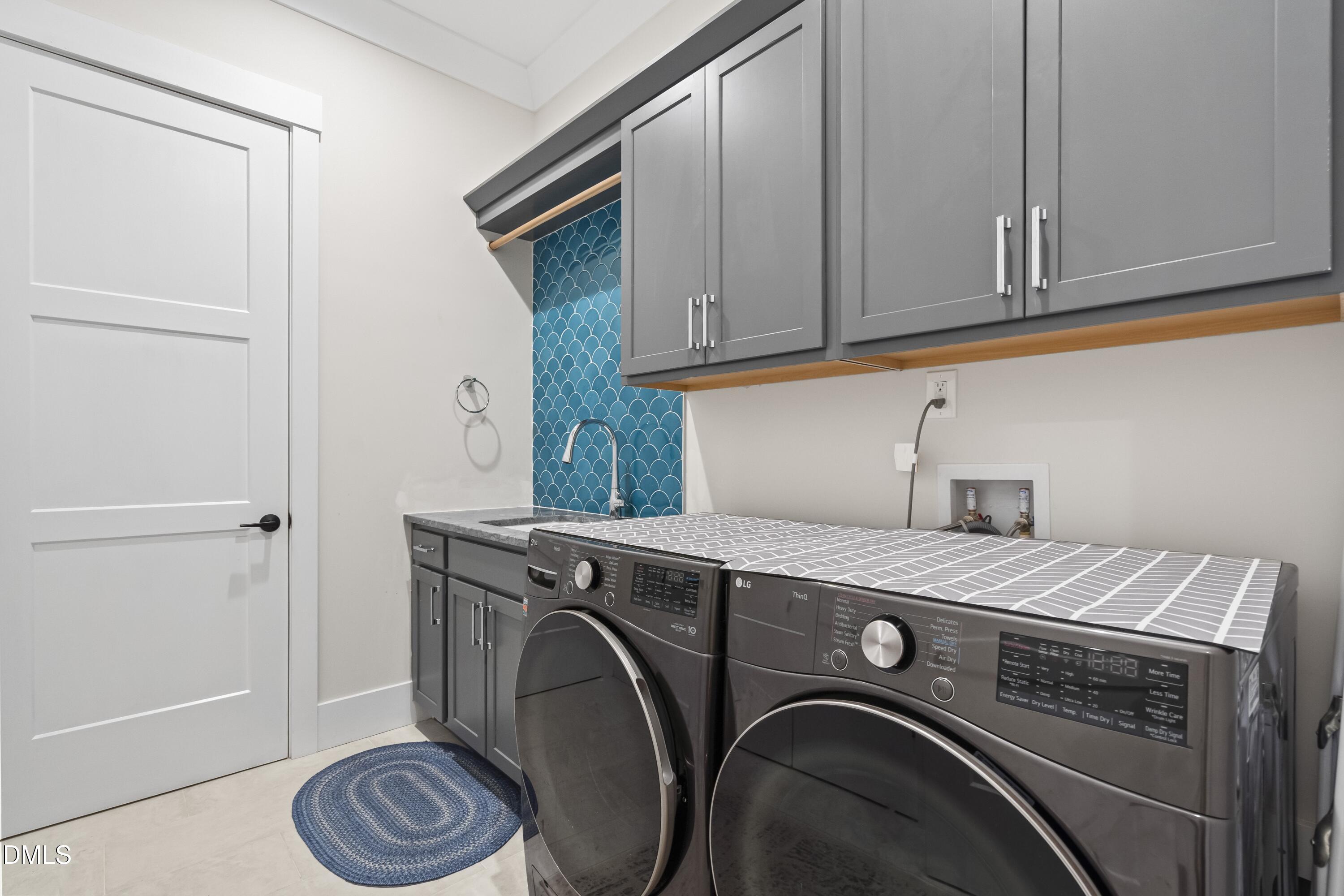 2205 Duskywing Drive Raleigh, NC 27613 - Photo 21 of 38 a utility room with dryer and washer