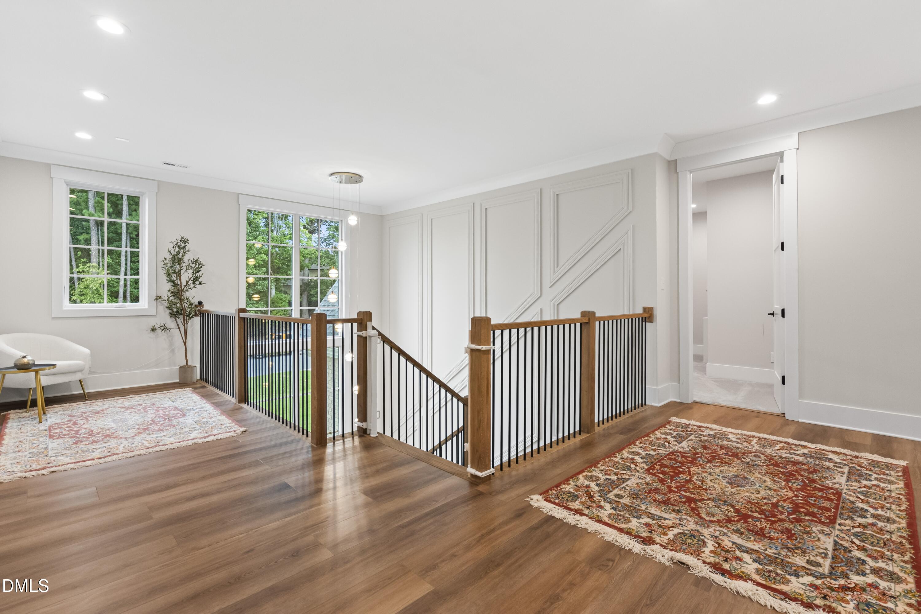 2205 Duskywing Drive Raleigh, NC 27613 - Photo 25 of 38 a view of an empty room with wooden floor and a window