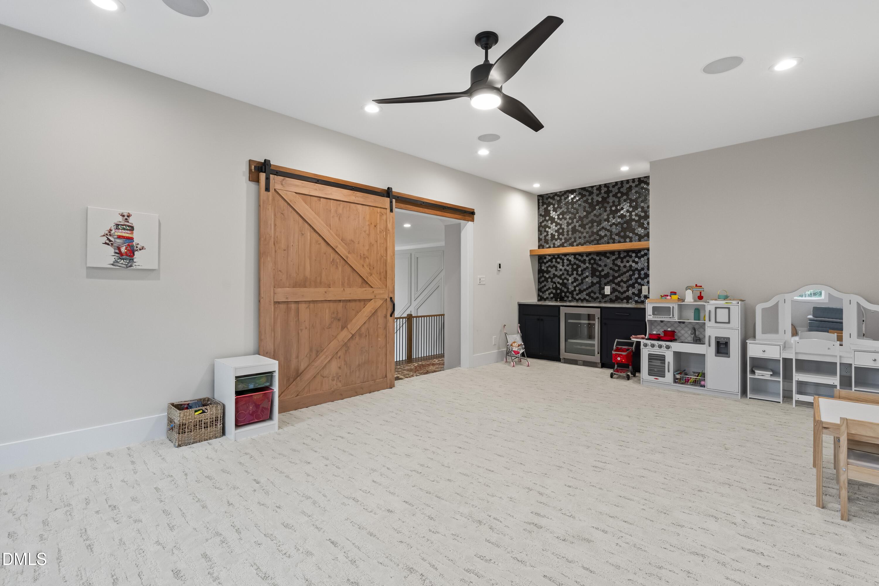 2205 Duskywing Drive Raleigh, NC 27613 - Photo 28 of 38 a view of a livingroom with furniture and a ceiling fan