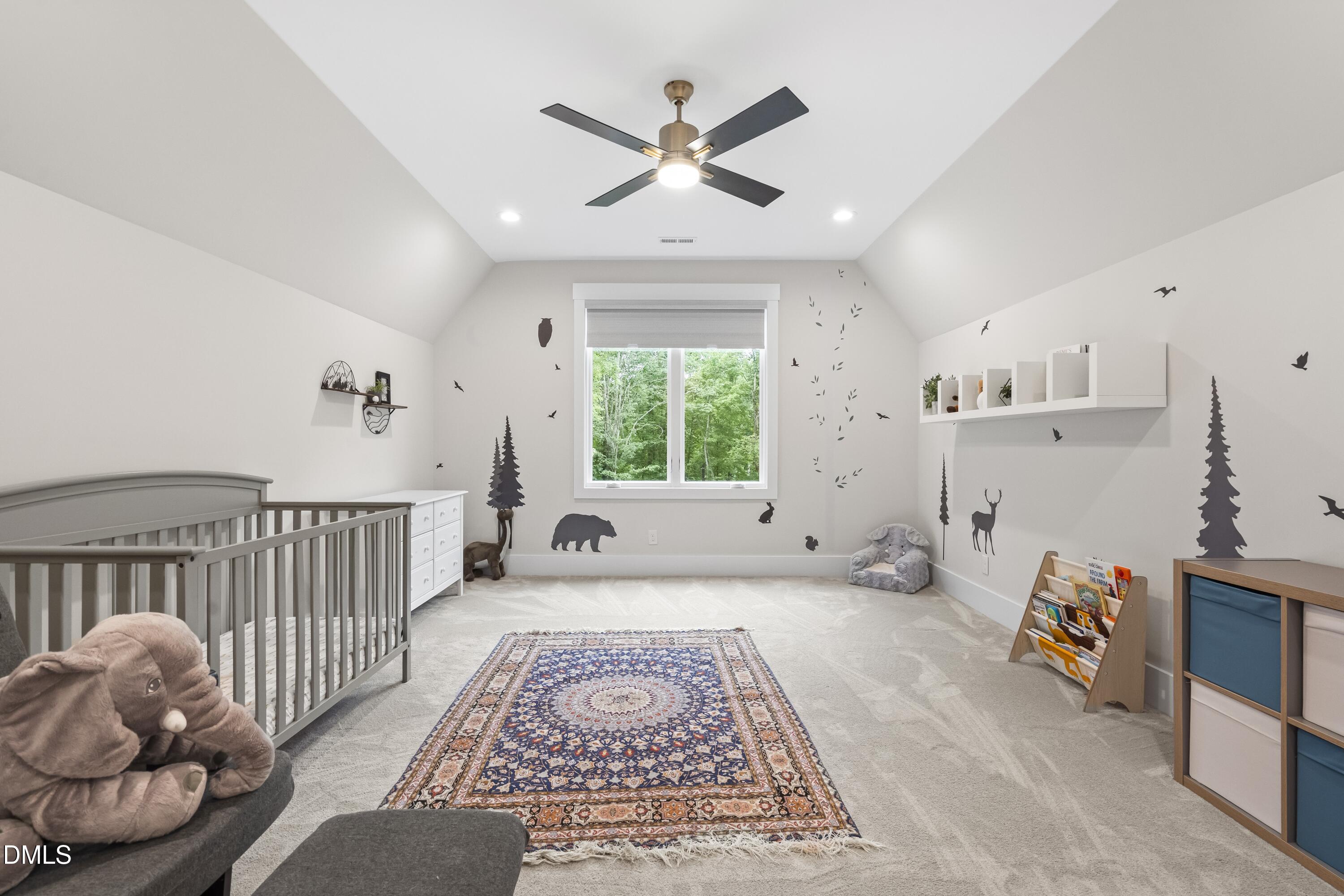 2205 Duskywing Drive Raleigh, NC 27613 - Photo 32 of 38 a very nice looking bedroom with a large bed and a window