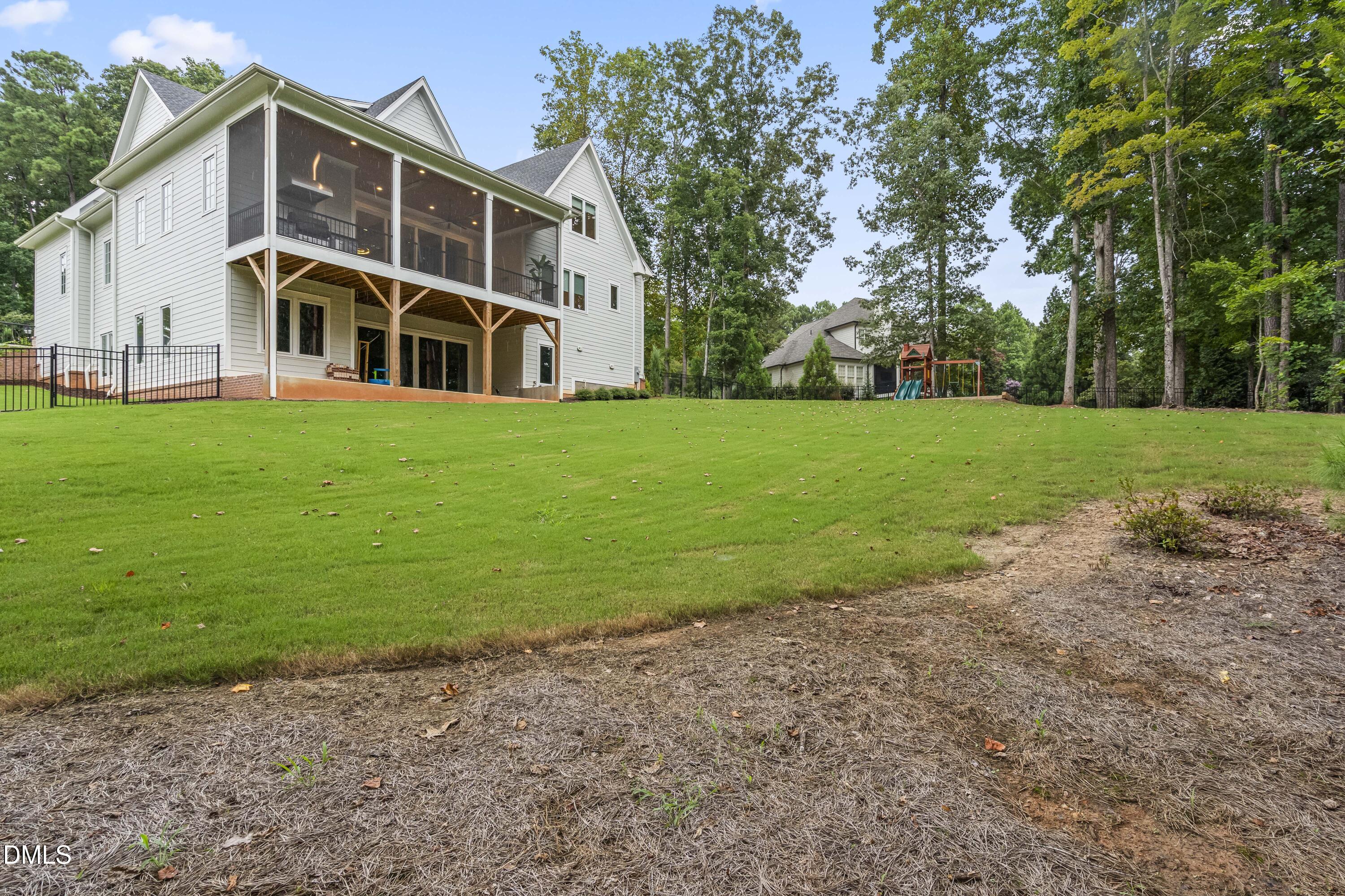 2205 Duskywing Drive Raleigh, NC 27613 - Photo 36 of 38 a front view of a house with a yard