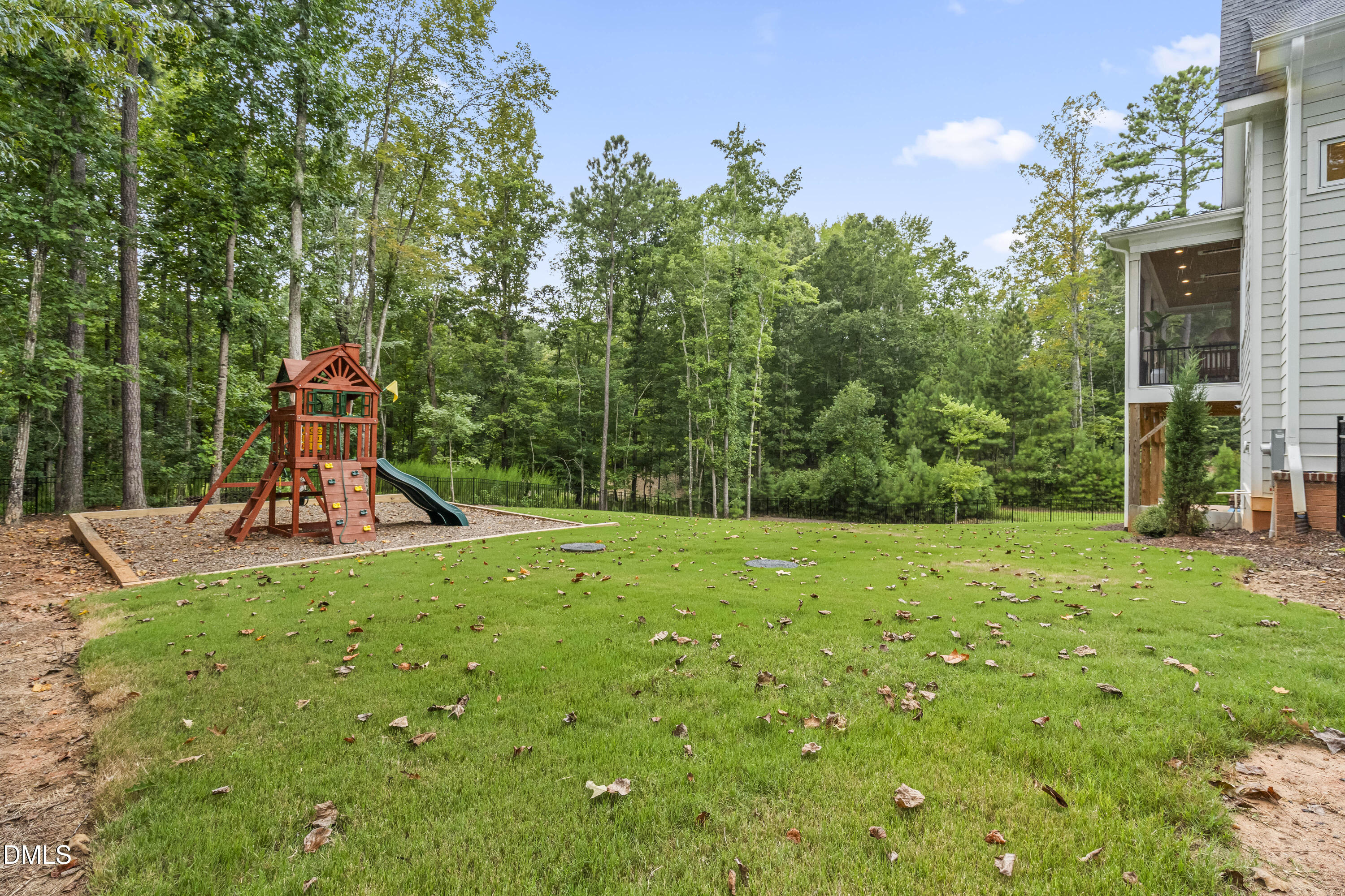 2205 Duskywing Drive Raleigh, NC 27613 - Photo 37 of 38 a view of a garden with a slide