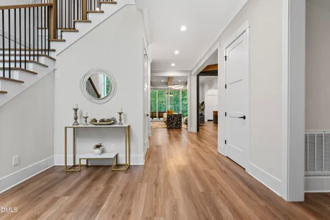 a living room with furniture a wooden floor and a window