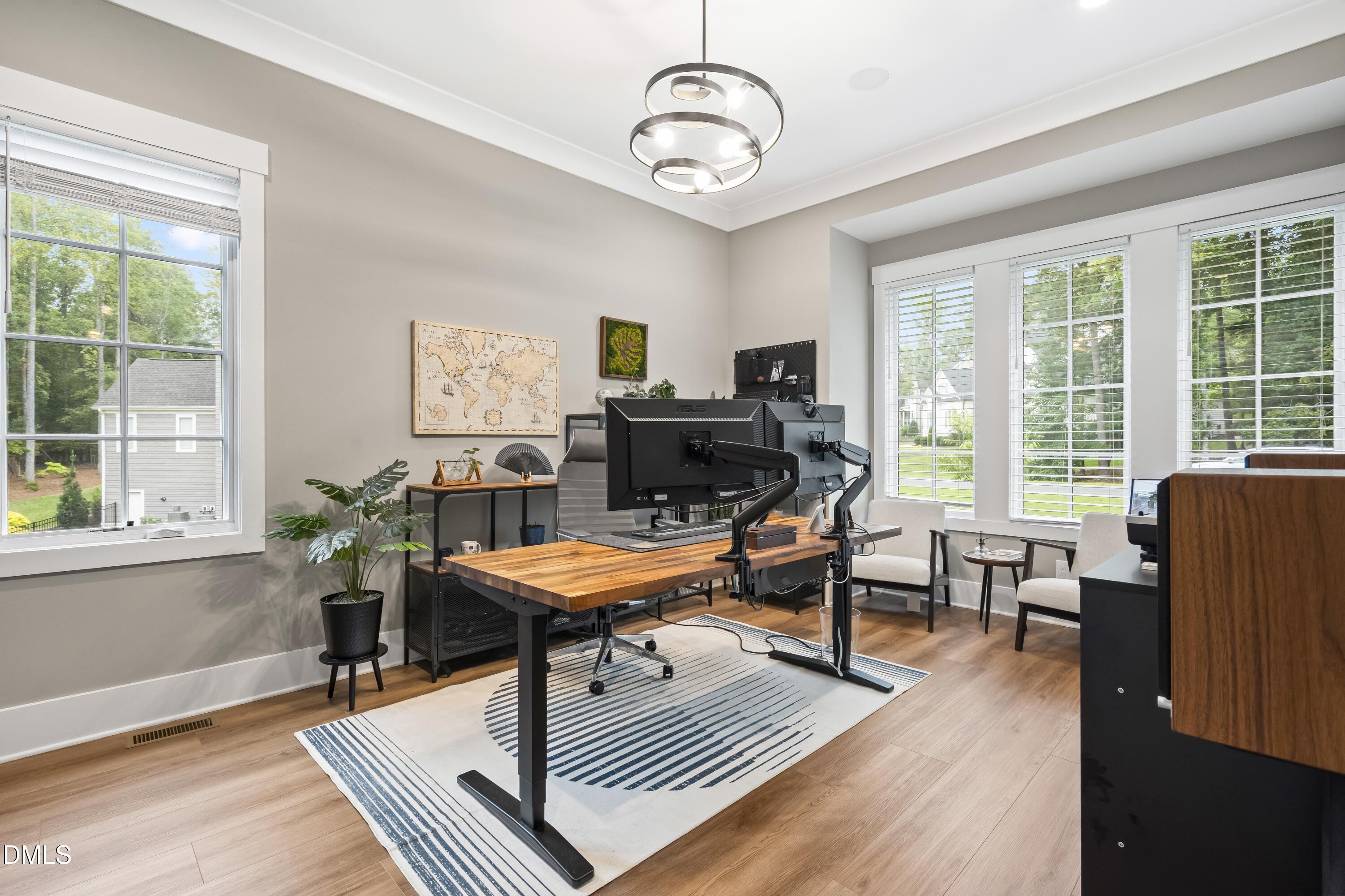 2205 Duskywing Drive Raleigh, NC 27613 - Photo 5 of 38 a living room with furniture a wooden floor and a window