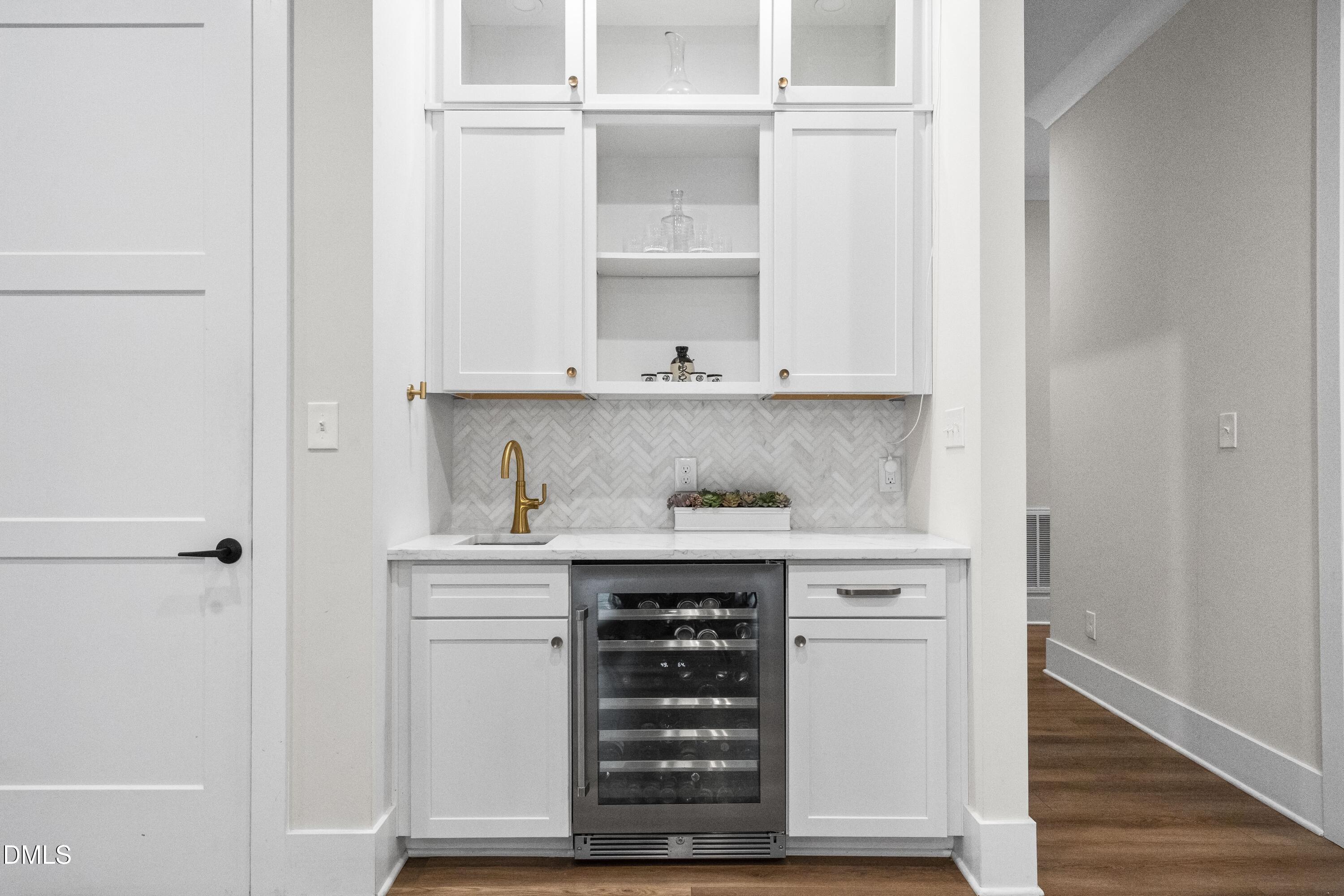 2205 Duskywing Drive Raleigh, NC 27613 - Photo 10 of 38 a view of cabinets and wooden floor