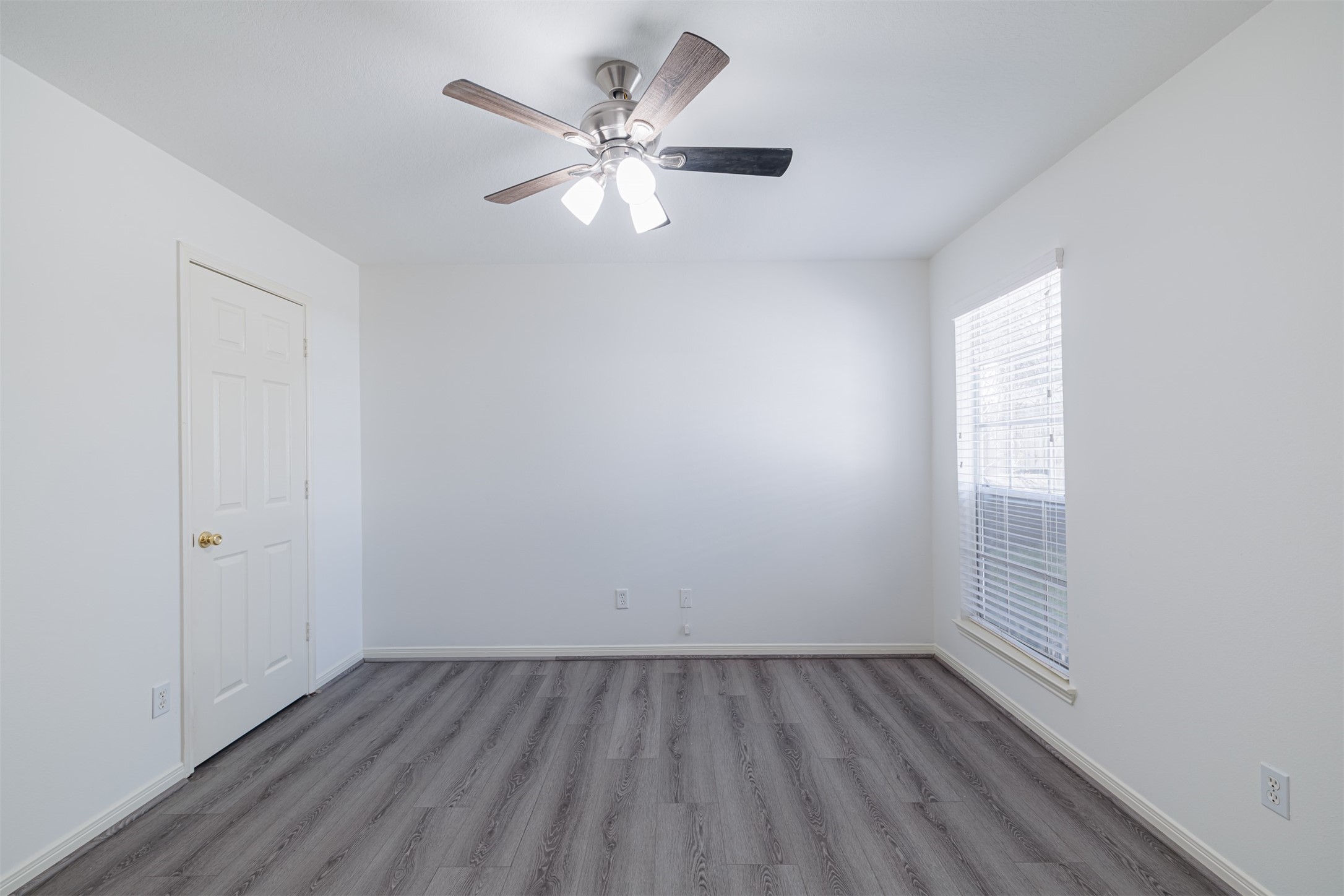 15022 Sapling Oak Court Houston, TX 77082 - Photo 25 of 32 wooden floor in an empty room with a window