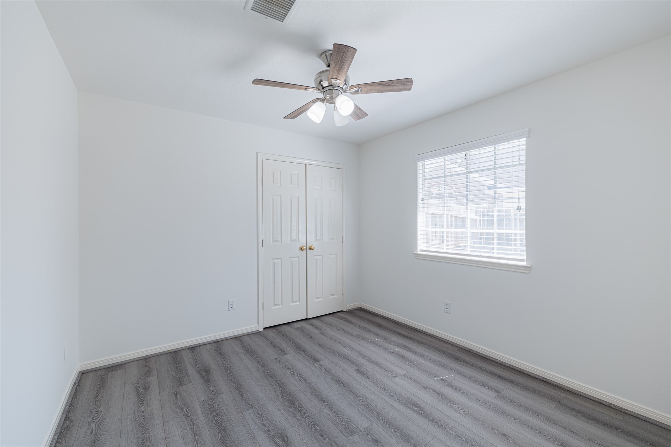 15022 Sapling Oak Court Houston, TX 77082 - Photo 28 of 32 wooden floor in an empty room with a window