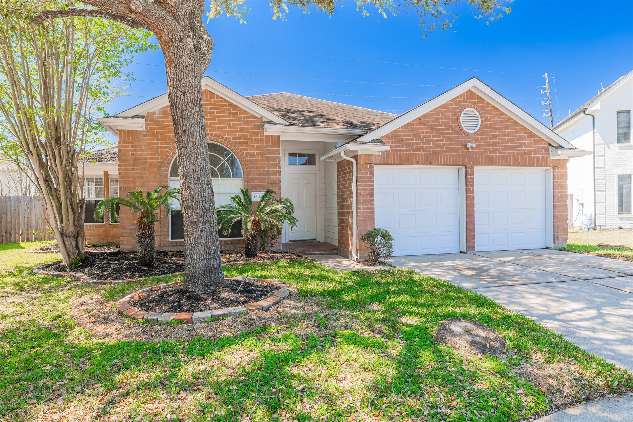 15022 Sapling Oak Court Houston, TX 77082 - Photo 31 of 32 a front view of a house with a yard