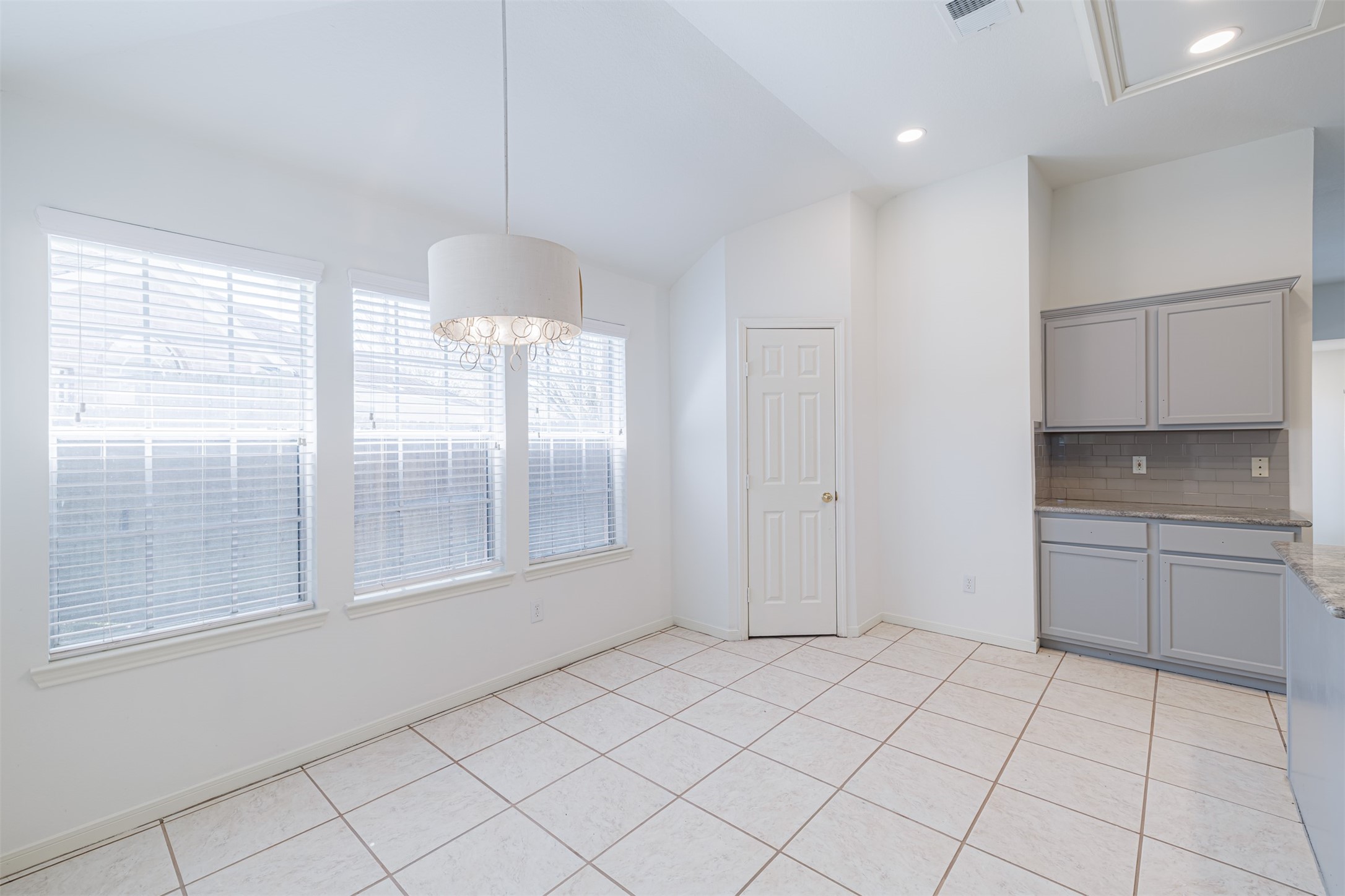 15022 Sapling Oak Court Houston, TX 77082 - Photo 10 of 32 a view of an empty room with window and kitchen view