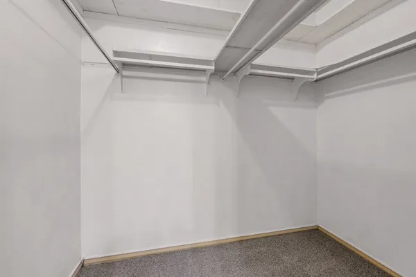 a view of an empty walk in closet