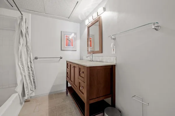 a bathroom with a sink and a mirror