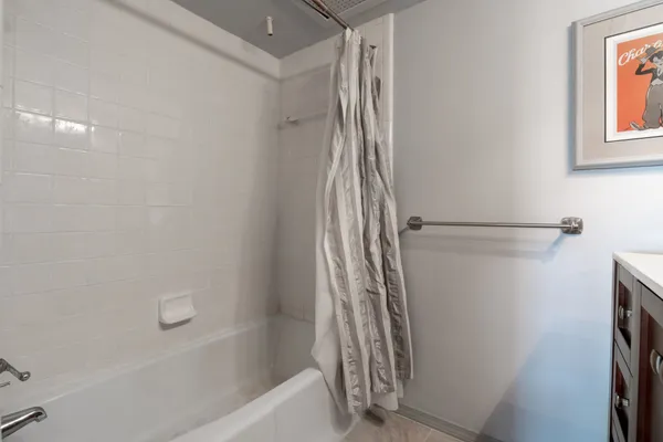 a bathroom with a bathtub and a shower