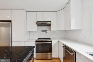 436 Brown Street Philadelphia, PA 19123 - Photo 18 of 62 a kitchen with appliances a sink and cabinets