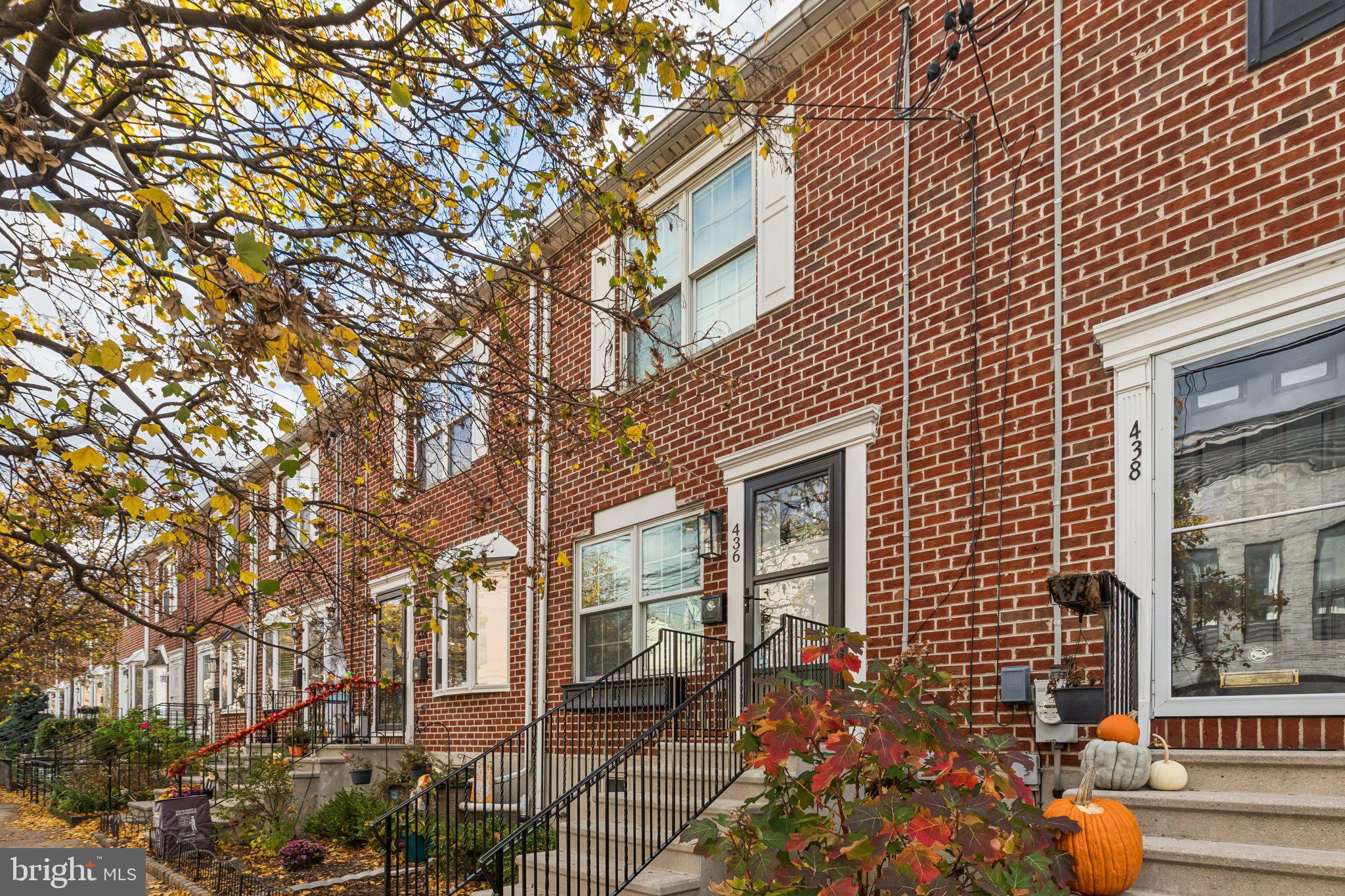 436 Brown Street Philadelphia, PA 19123 - Photo 2 of 62 front view of a brick house with a large tree