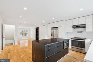 436 Brown Street Philadelphia, PA 19123 - Photo 21 of 62 a kitchen with stainless steel appliances granite countertop a stove a sink and a refrigerator