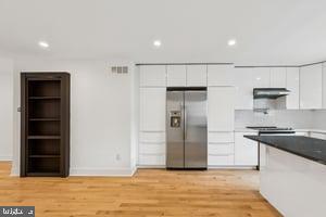 436 Brown Street Philadelphia, PA 19123 - Photo 22 of 62 a kitchen with stainless steel appliances granite countertop a refrigerator and a stove top oven