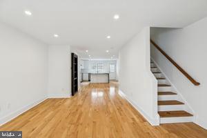 436 Brown Street Philadelphia, PA 19123 - Photo 3 of 62 a view of a hallway with wooden floor and staircase