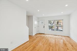 436 Brown Street Philadelphia, PA 19123 - Photo 10 of 62 an empty room with wooden floor and windows