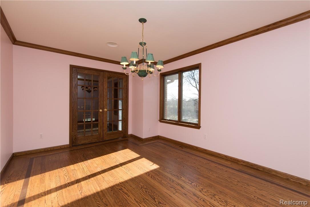 7432 Dutch Road Goodrich, MI 48438 - Photo 15 of 35 Formal Dining has French Doors and Beautiful Hardwood with a Perimeter Inlay