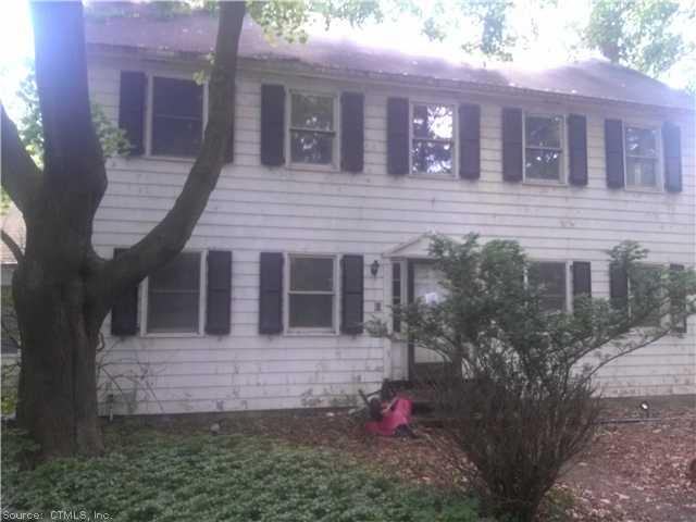 a view of a house with brick walls