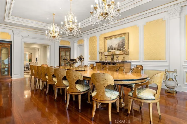 a bedroom with furniture and a chandelier