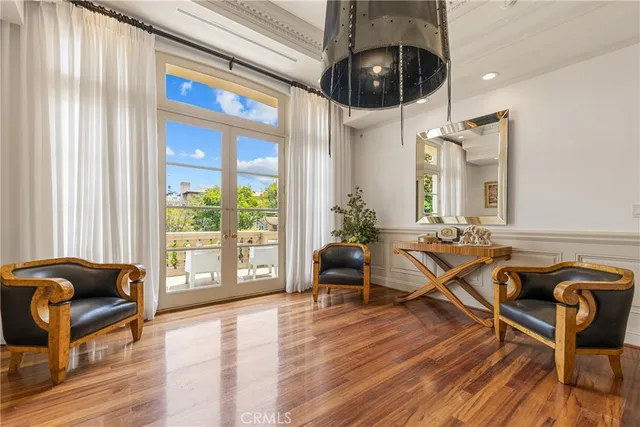 a bedroom with a large bed and a large window