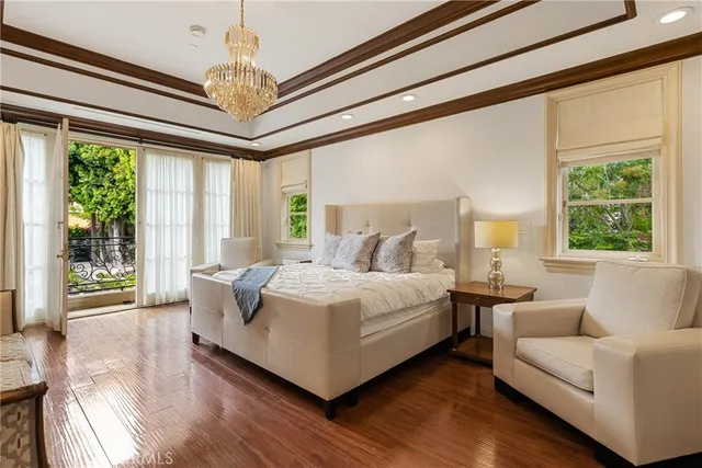 a view of a swimming pool with an outdoor seating and a garden