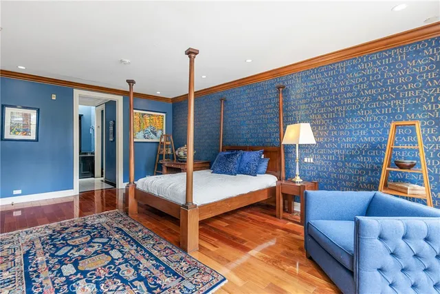 a view of multiple houses with a yard and potted plants