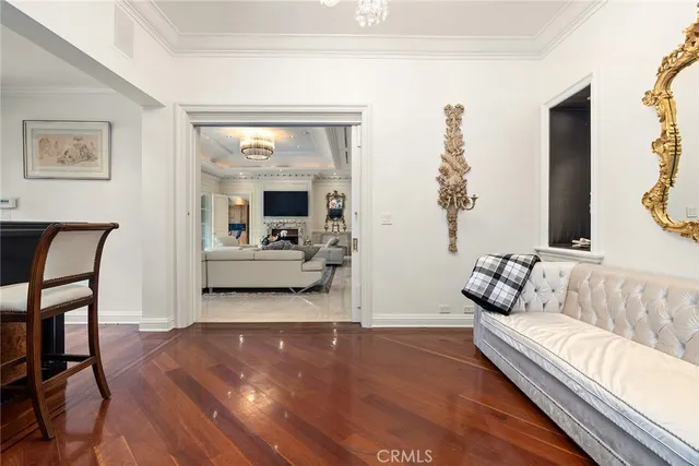 a living room with fireplace furniture and a wooden floor