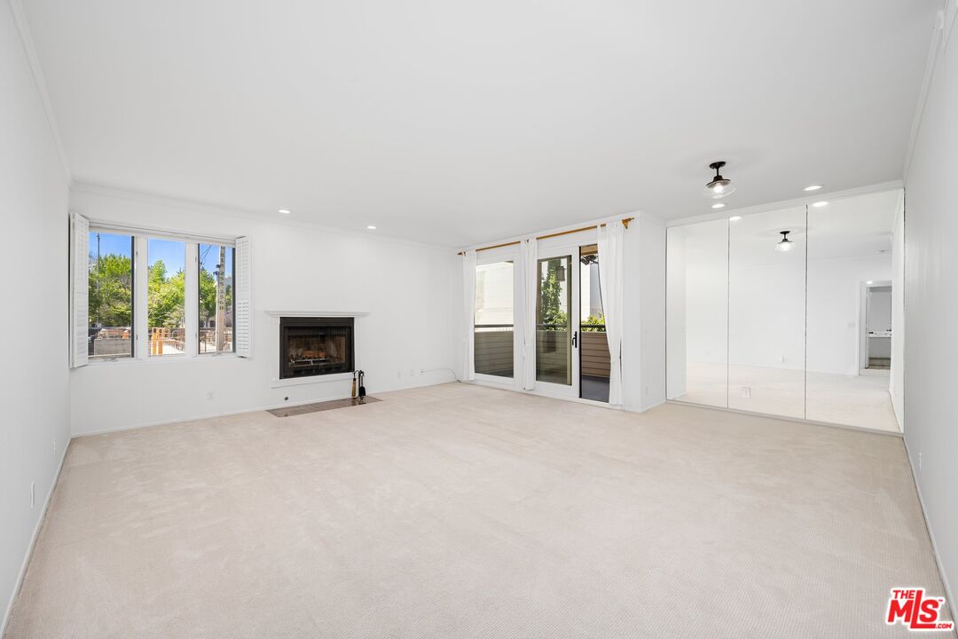 1808 Manning Avenue, Unit 103 Los Angeles, CA 90025 - Photo 2 of 13 a view of an empty room with a window
