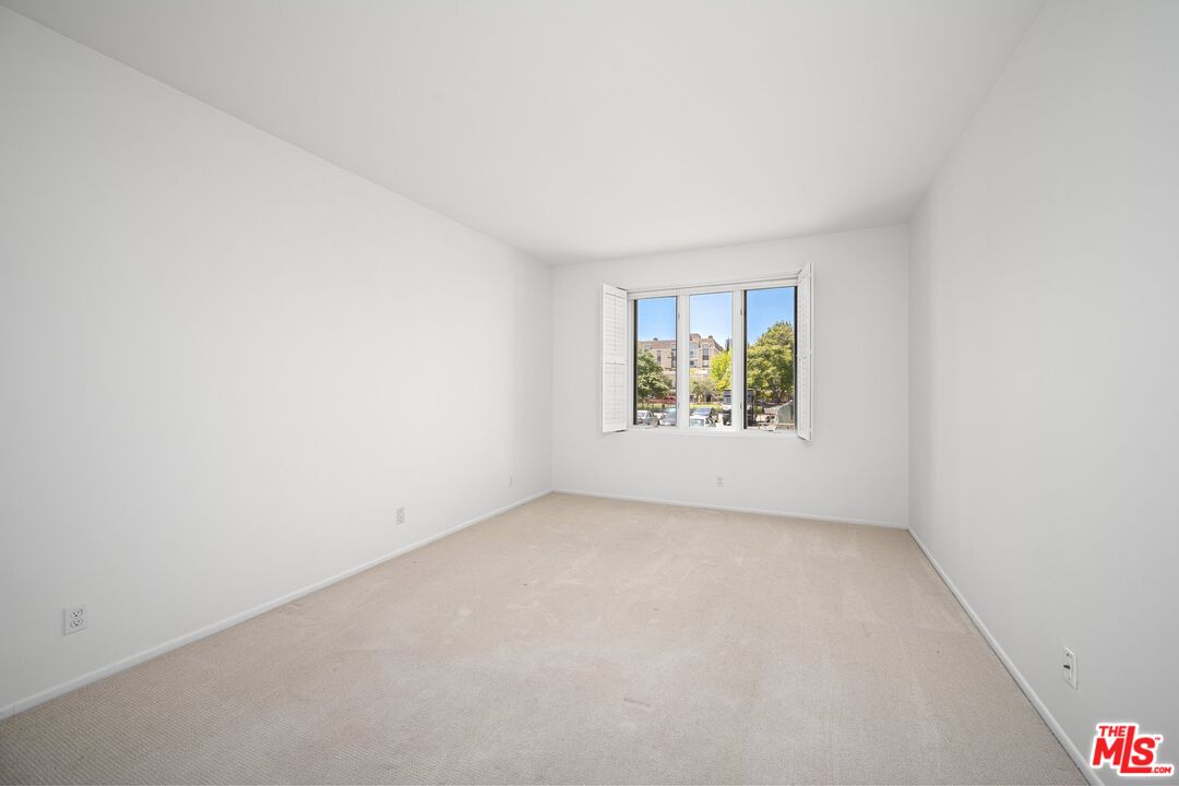 1808 Manning Avenue, Unit 103 Los Angeles, CA 90025 - Photo 7 of 13 an empty room with windows