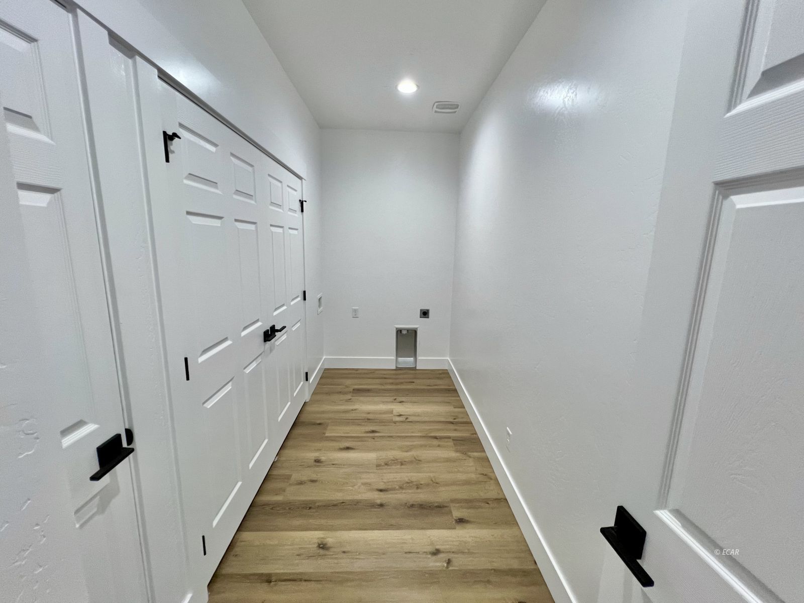 610 Ridgeway Drive Spring Creek, NV 89815 - Photo 29 of 33 a view of a hallway with wooden floor and staircase