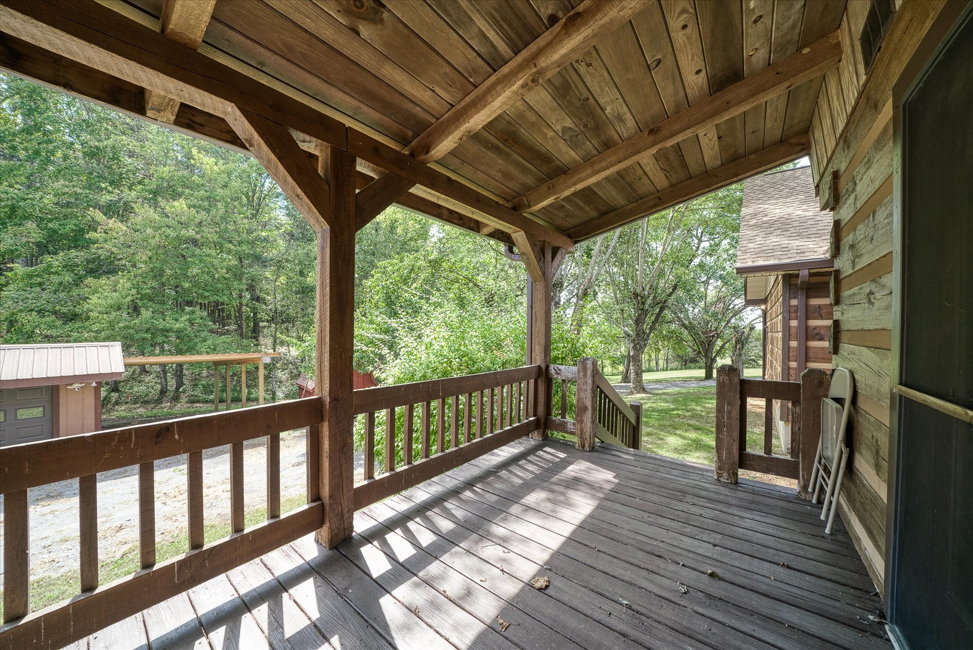 385 Paul Reecer Road Moss, TN 38575 - Photo 28 of 75 a view of porch with wooden floor and furniture