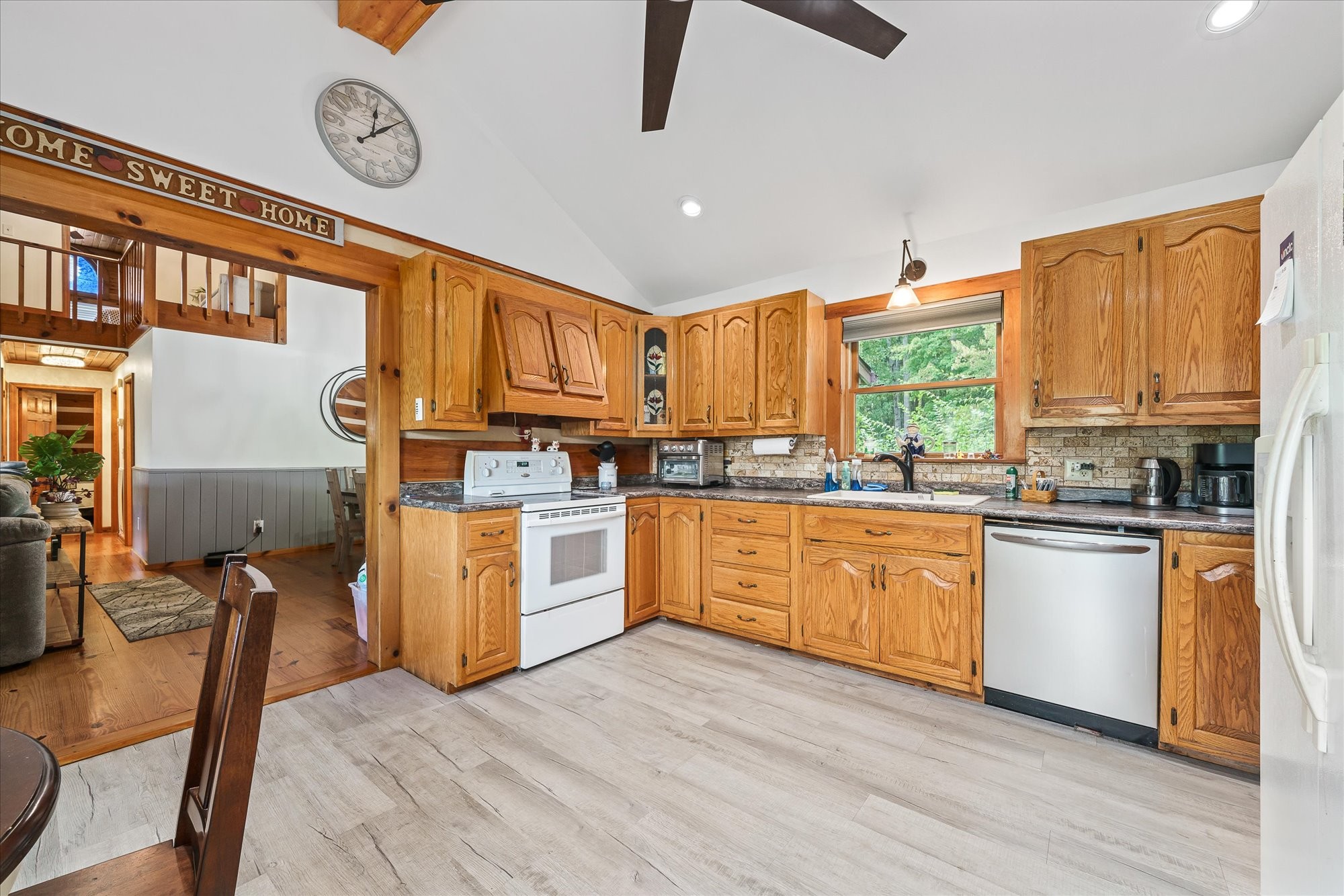 385 Paul Reecer Road Moss, TN 38575 - Photo 36 of 75 a kitchen with stainless steel appliances granite countertop a stove a sink dishwasher and a refrigerator with wooden floor