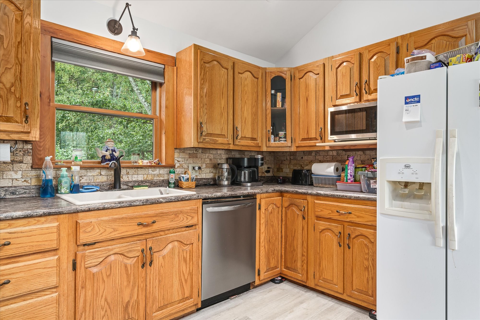 385 Paul Reecer Road Moss, TN 38575 - Photo 37 of 75 a kitchen with stainless steel appliances granite countertop a stove a sink and a refrigerator