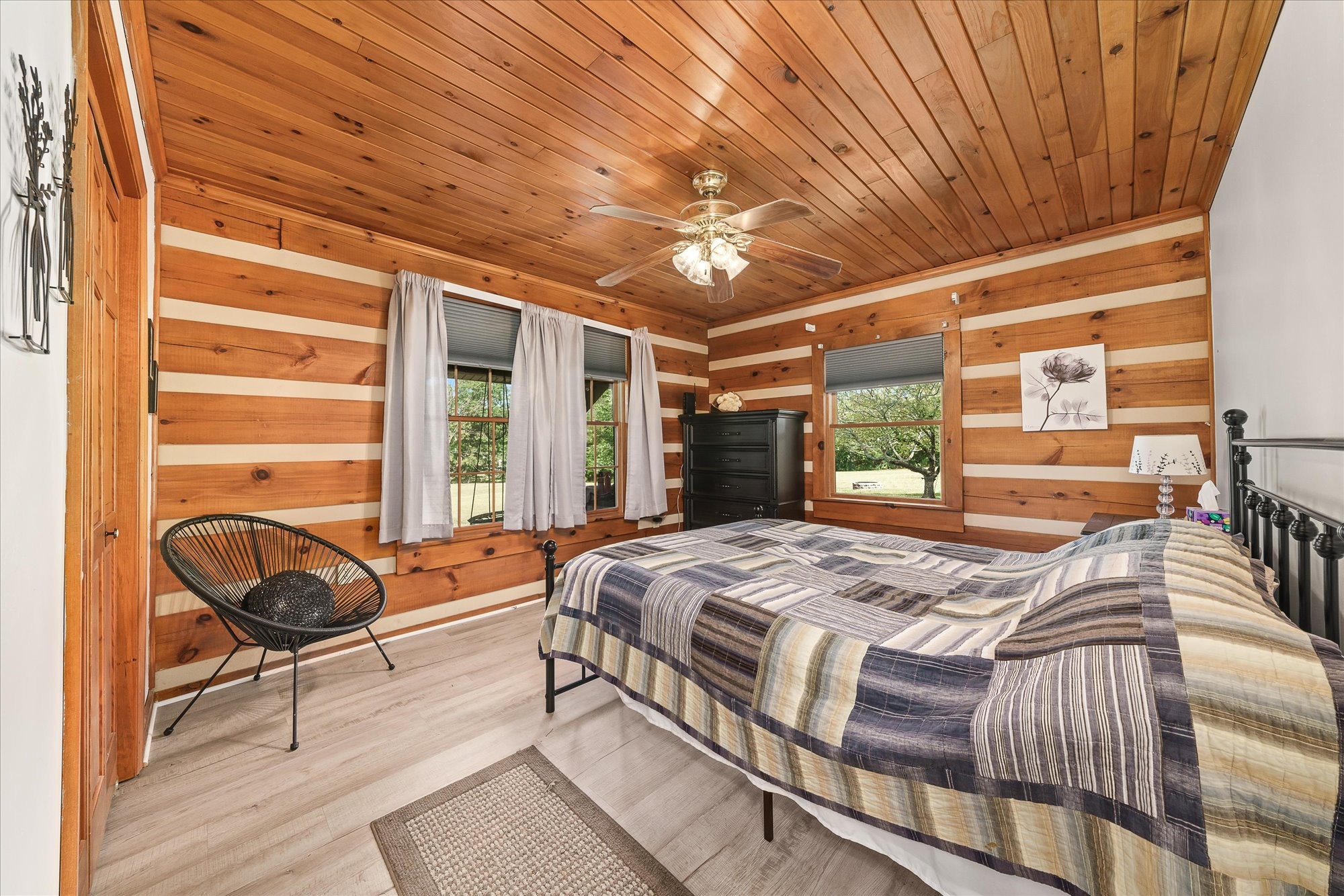 385 Paul Reecer Road Moss, TN 38575 - Photo 43 of 75 a bedroom with a bed and a large window with balcony view