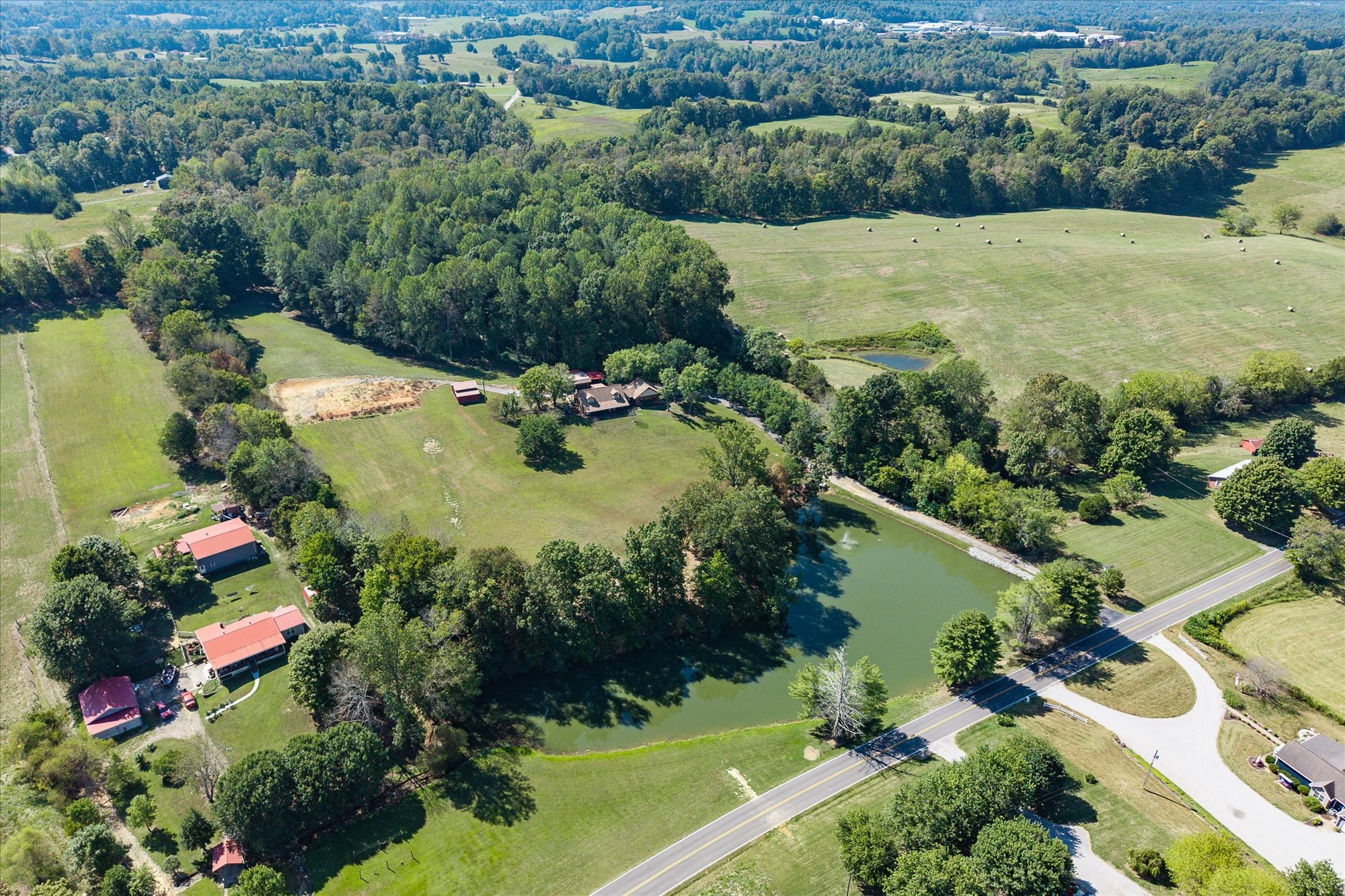 385 Paul Reecer Road Moss, TN 38575 - Photo 60 of 75 an aerial view of green landscape with trees houses and mountain view