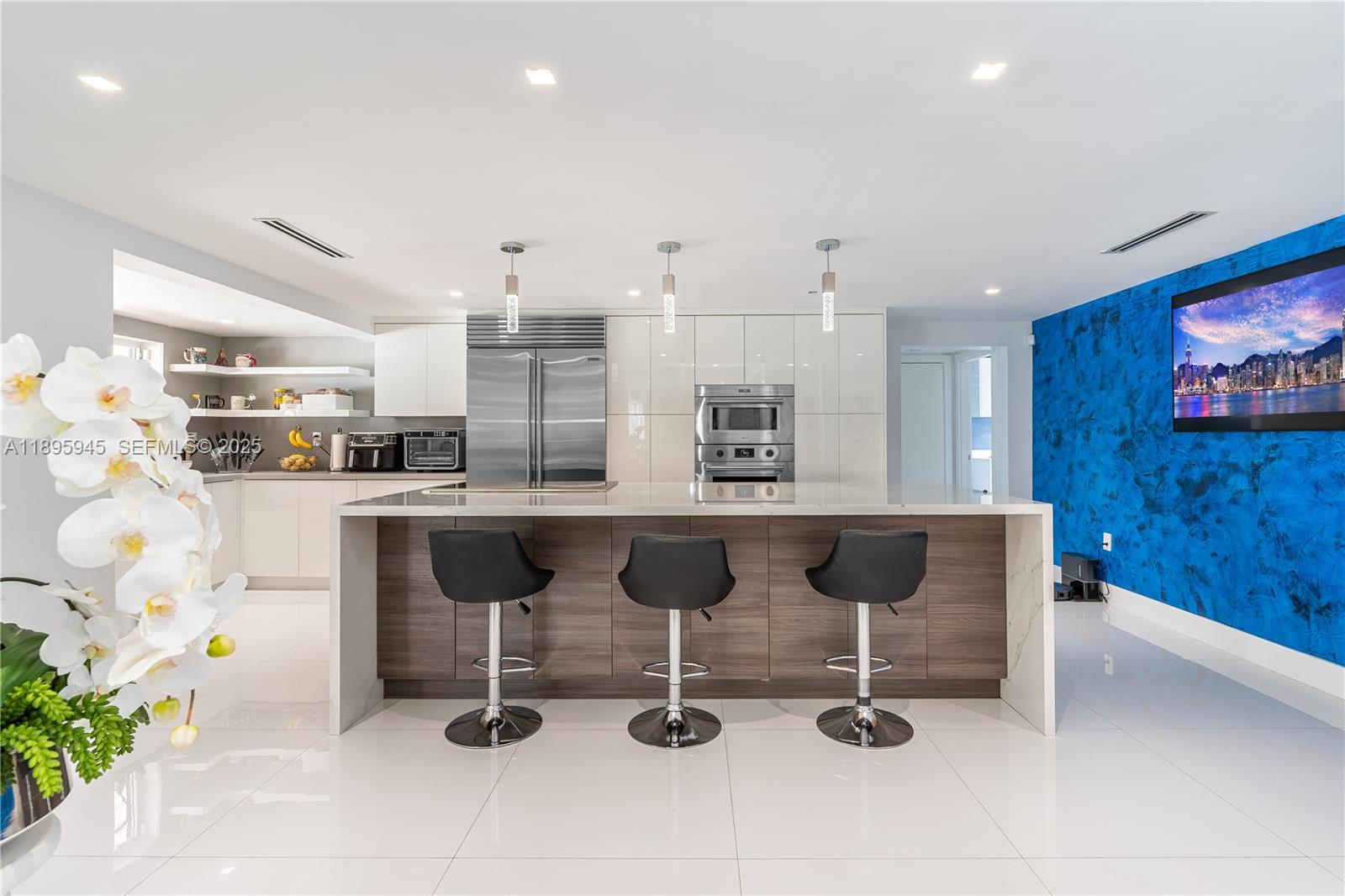 11531 Southwest 93rd Street Miami, FL 33176 - Photo 11 of 54 a living room with stainless steel appliances kitchen island granite countertop furniture and a kitchen view