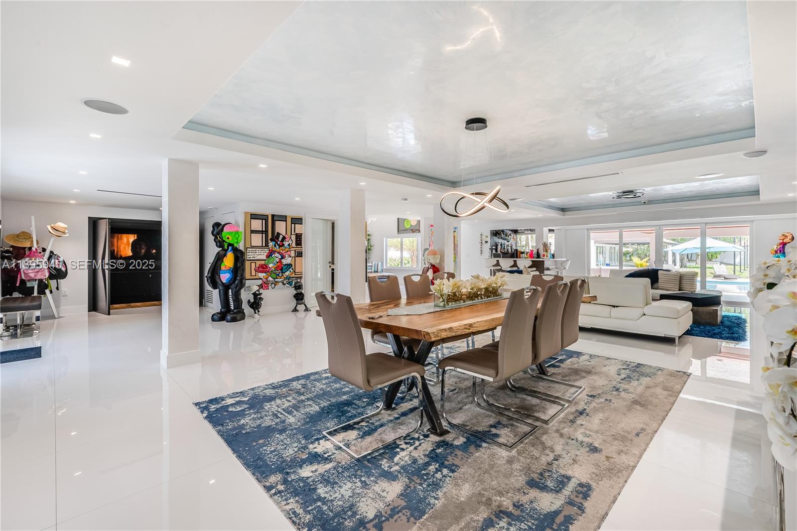 11531 Southwest 93rd Street Miami, FL 33176 - Photo 13 of 54 a living room with lots of furniture and view of kitchen